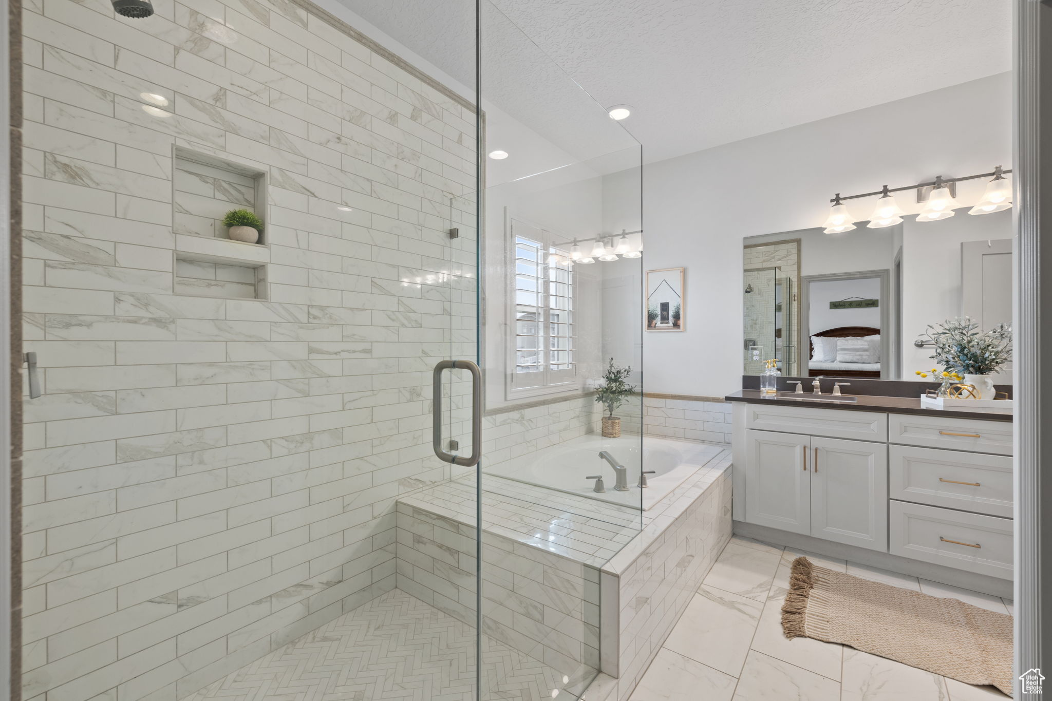 Bathroom with vanity and independent shower and bath