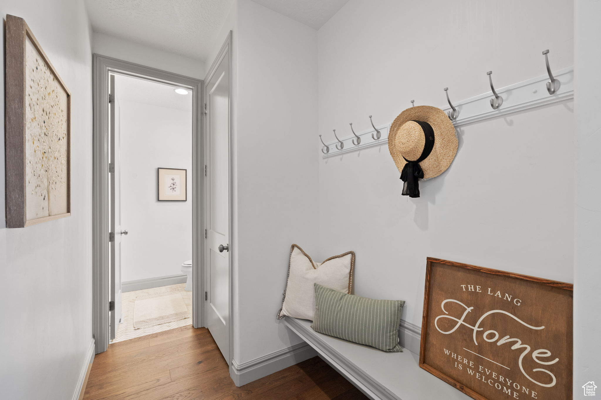 Mudroom featuring wood-type flooring