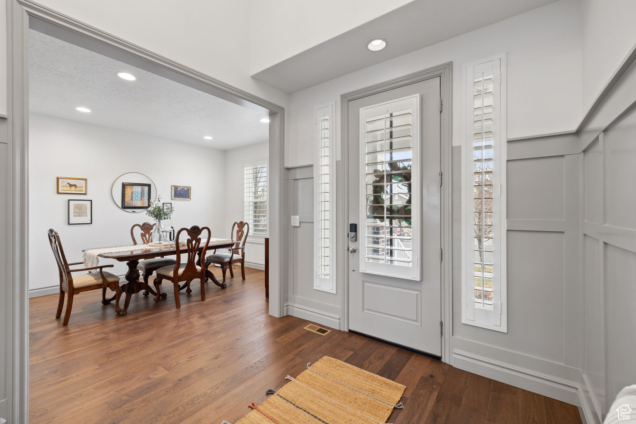 Entrance foyer with dark hardwood / wood-style flooring