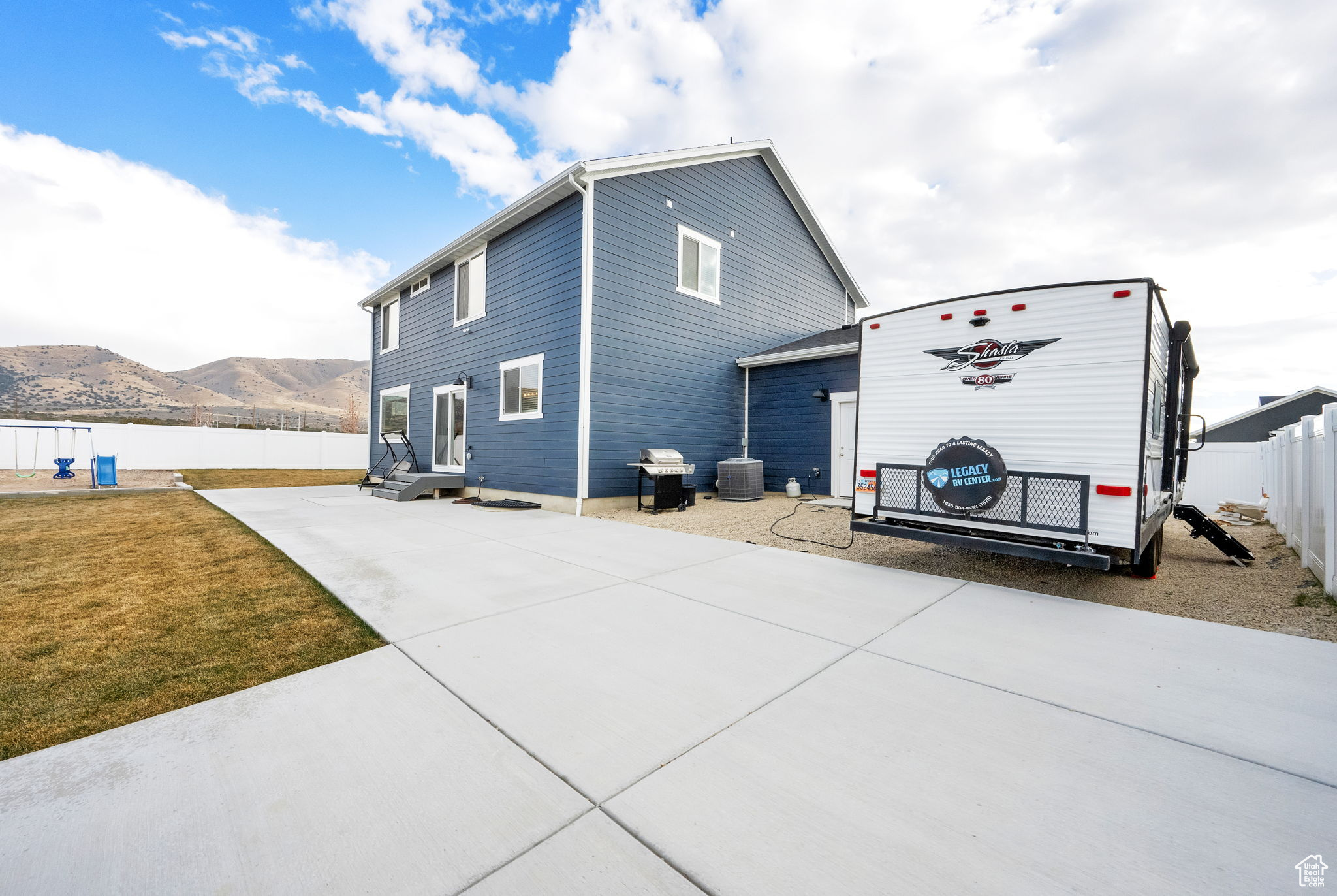 View of side of property with a mountain view