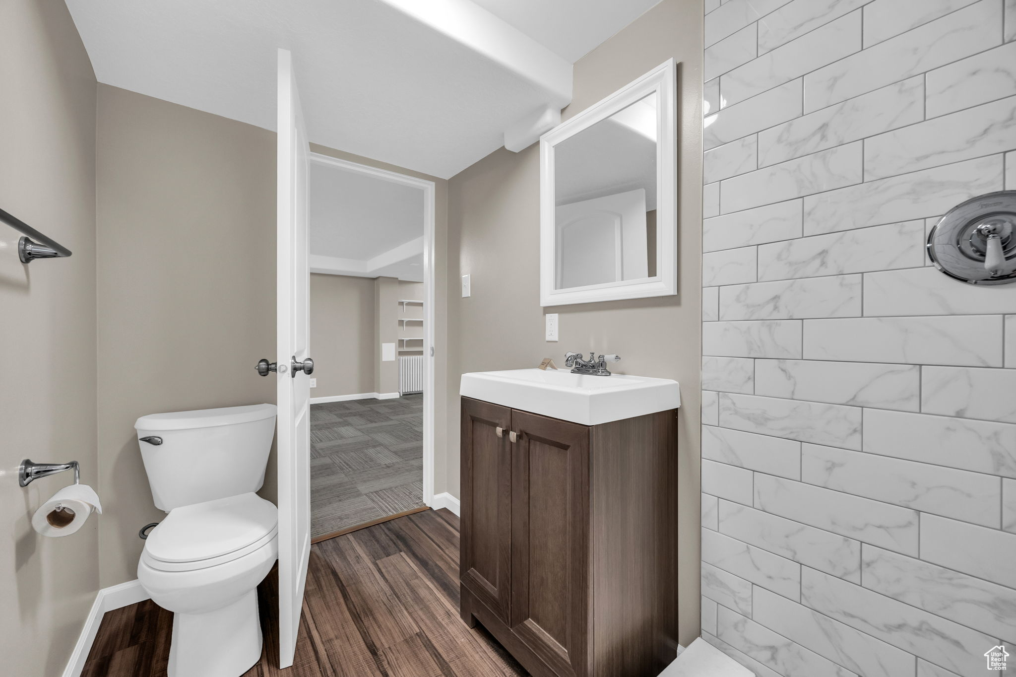 New bathroom featuring hardwood / wood-style floors, vanity, and toilet