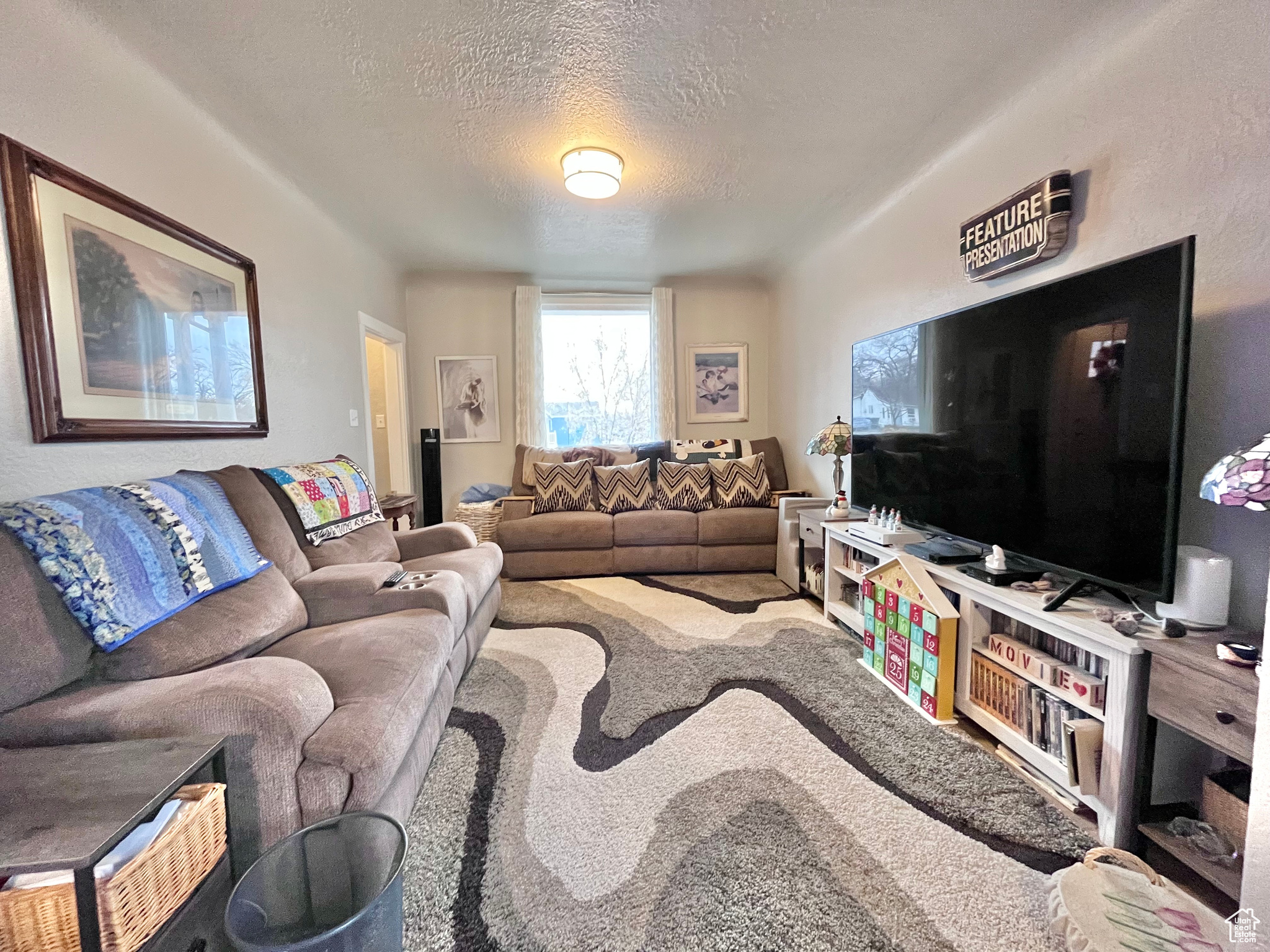 Living room featuring a textured ceiling