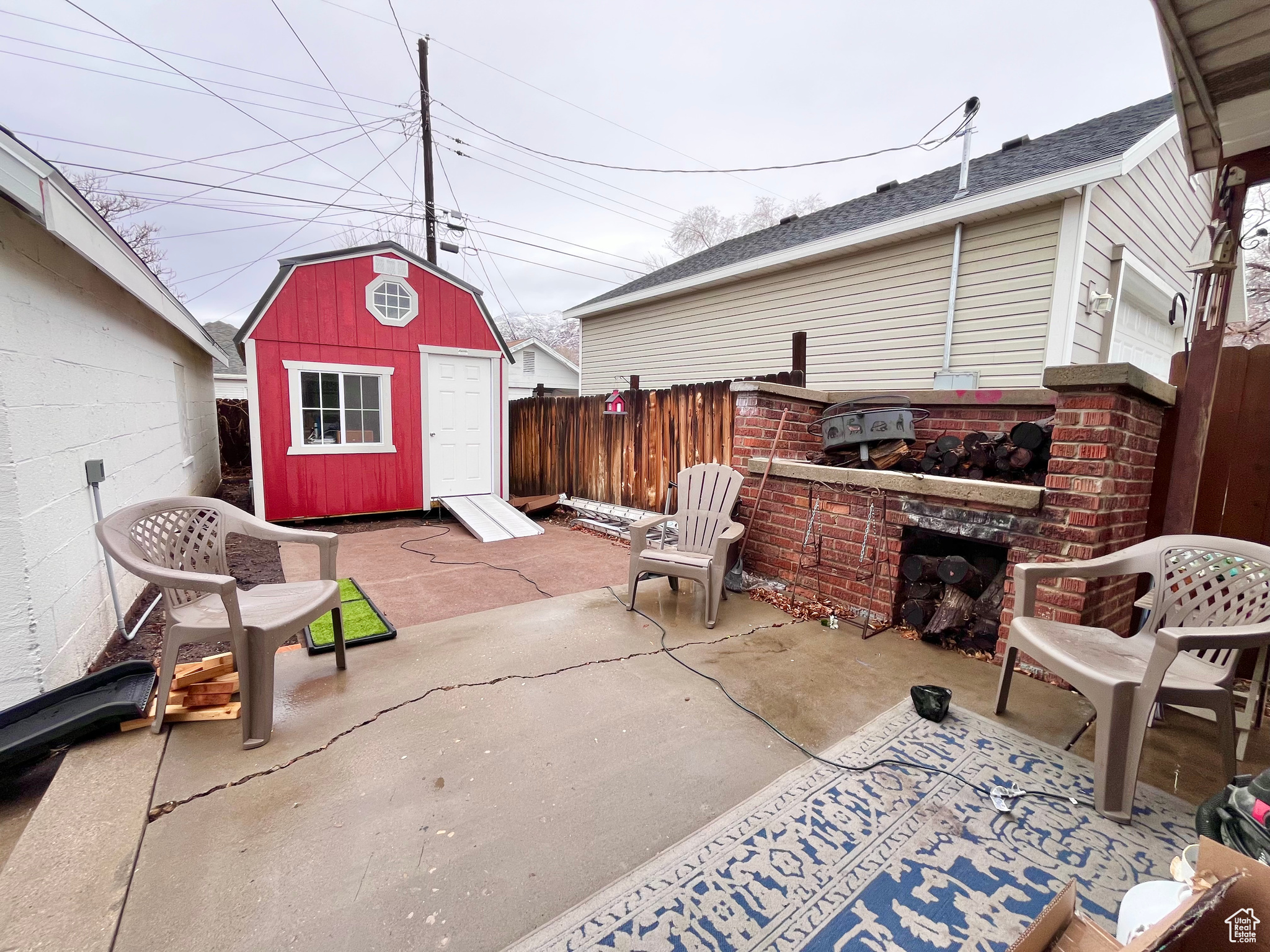 View of patio / terrace featuring a storage unit