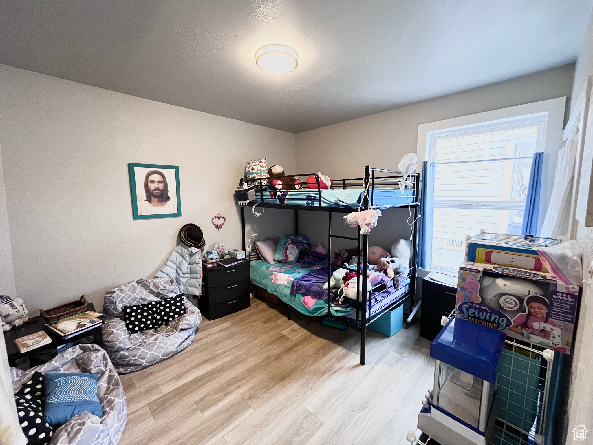 Bedroom with hardwood / wood-style floors