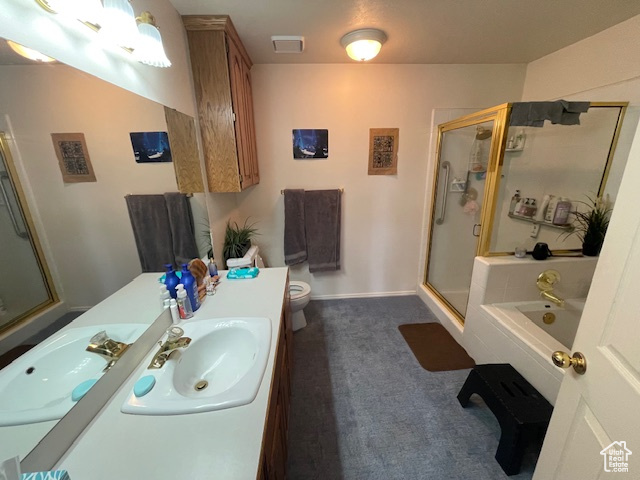 Full bathroom featuring plus walk in shower, vanity, and toilet