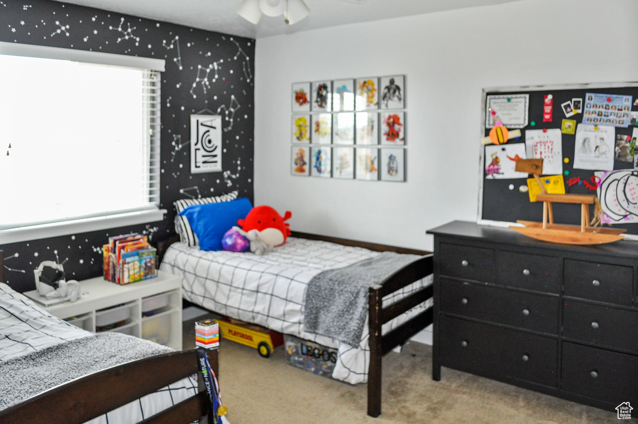 Bedroom featuring light carpet and ceiling fan