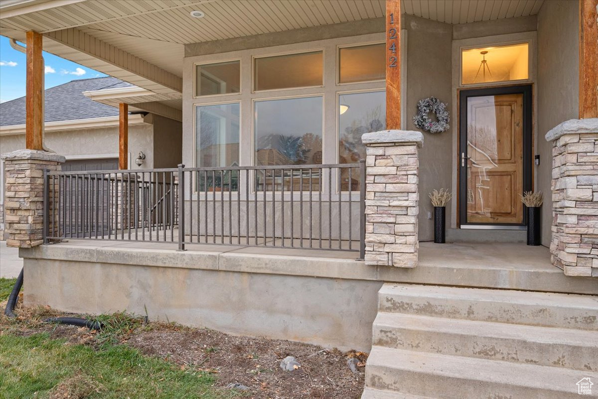 Doorway to property with a porch