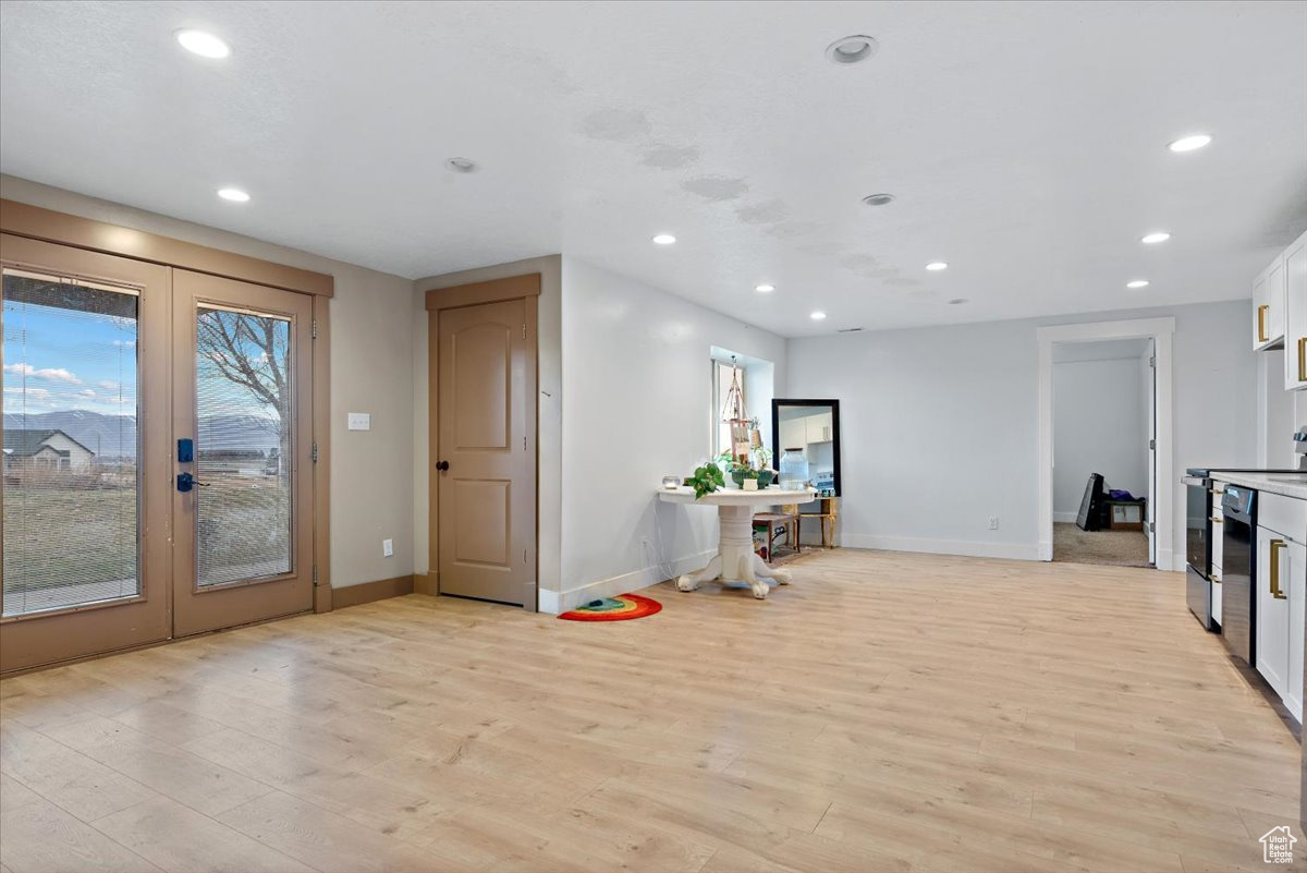 Interior space featuring light hardwood / wood-style floors and french doors