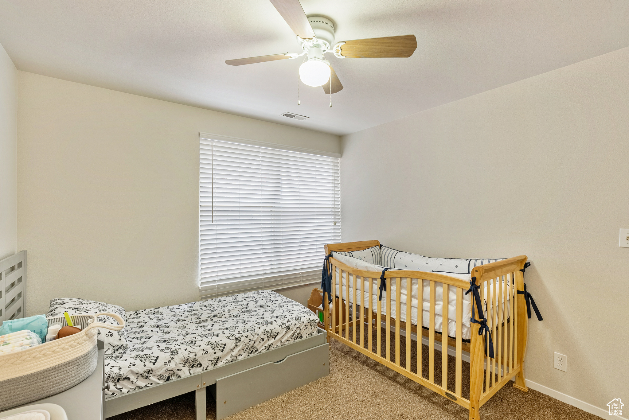 Bedroom featuring carpet and ceiling fan