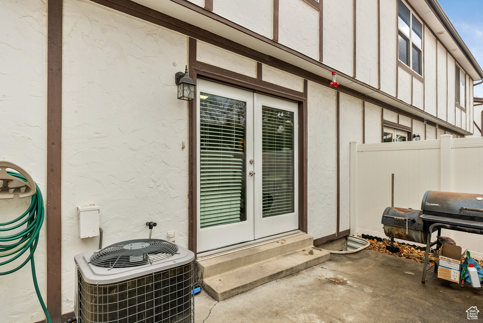 Property entrance with central air condition unit and french doors