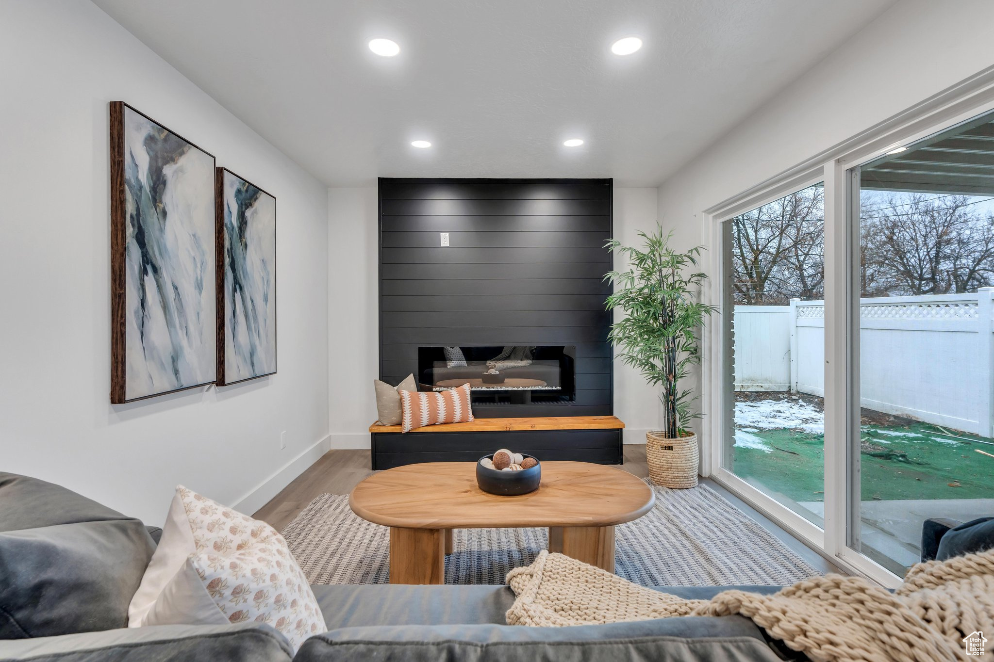 Living room featuring a fireplace and wood-type flooring