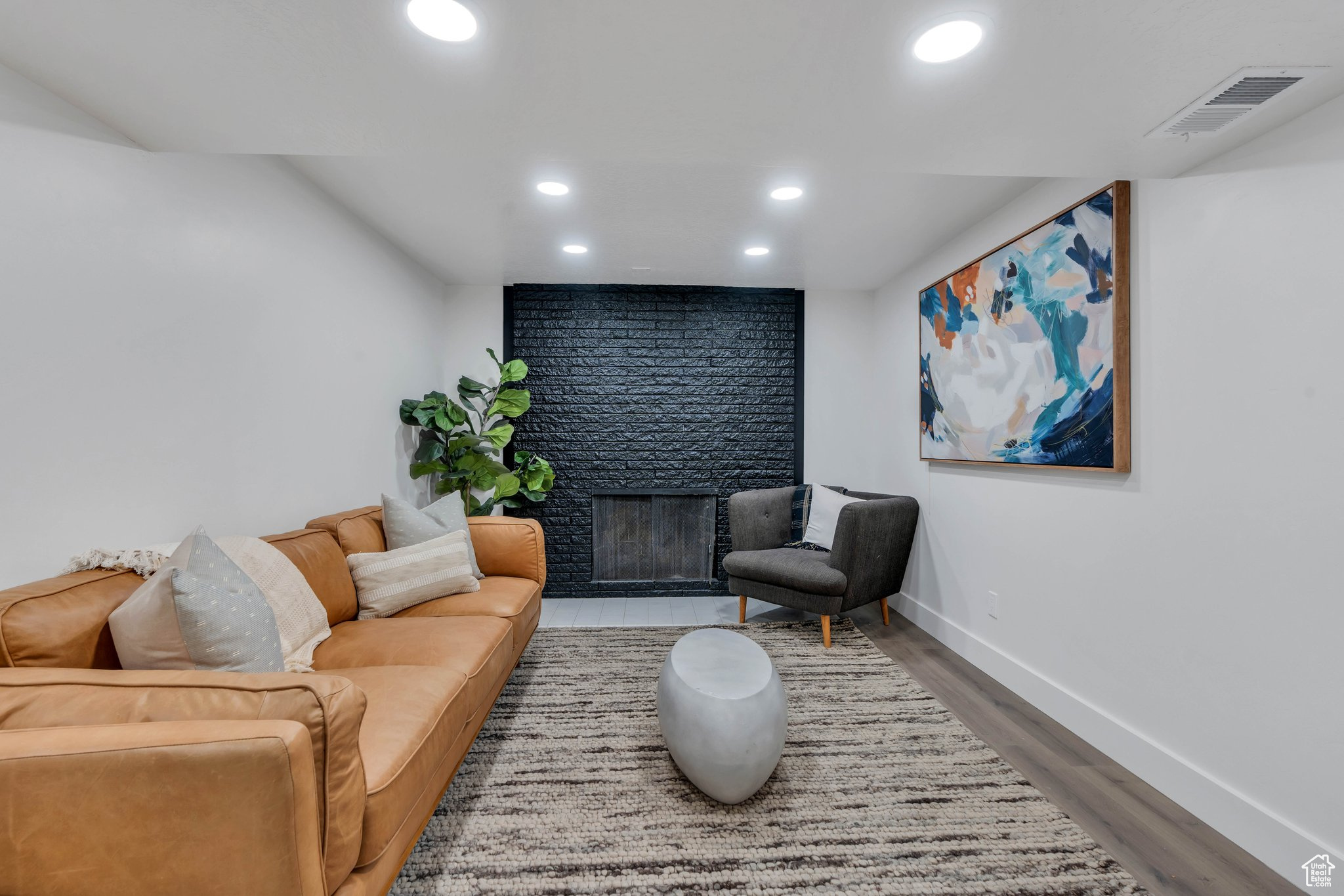 Living room featuring a fireplace and hardwood / wood-style floors