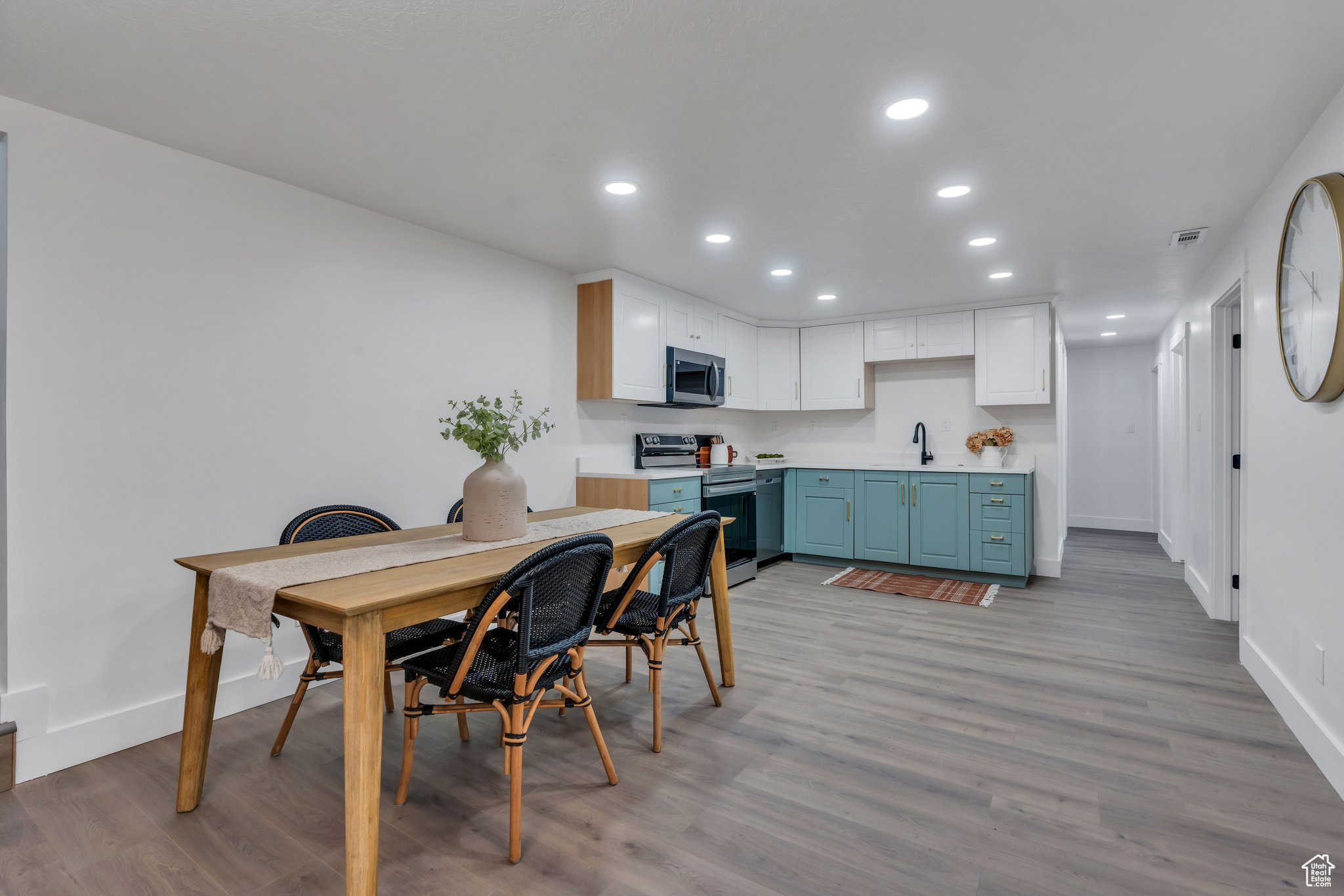 Dining space featuring light hardwood / wood-style flooring and sink