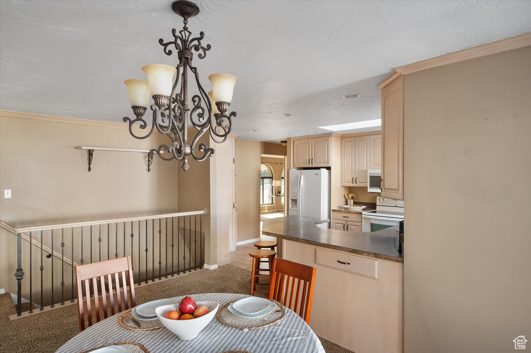 Semi-formal dining back to kitchen & main hallway