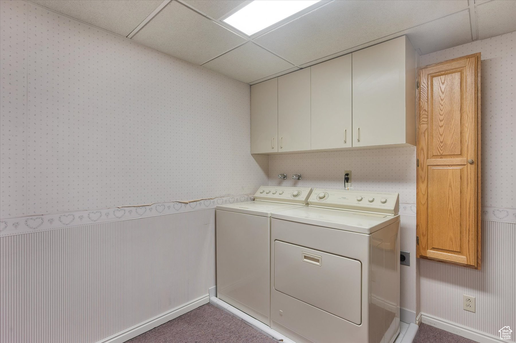 Laundry room with gas dryer hook-ups & built-in ironing board