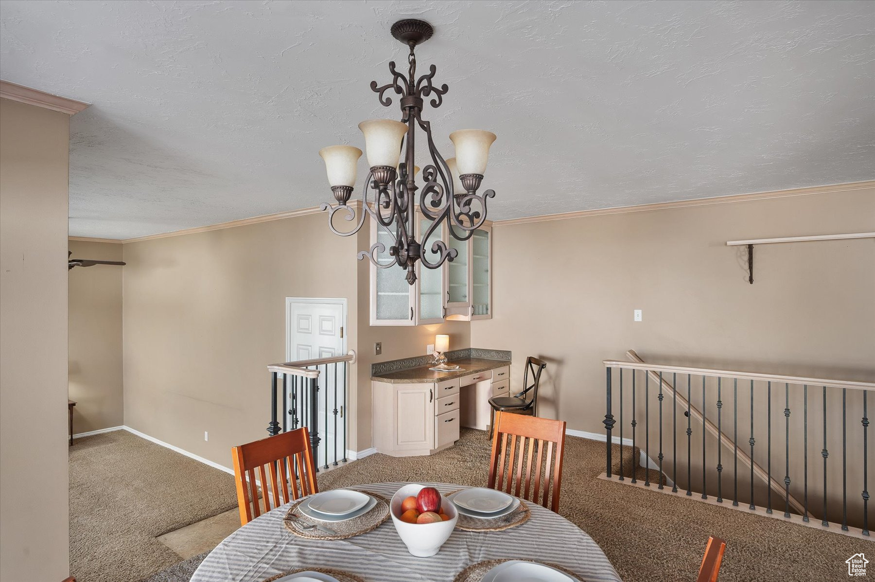 Semi-formal dining to built-in desk, stairs to basement & down to sunroom