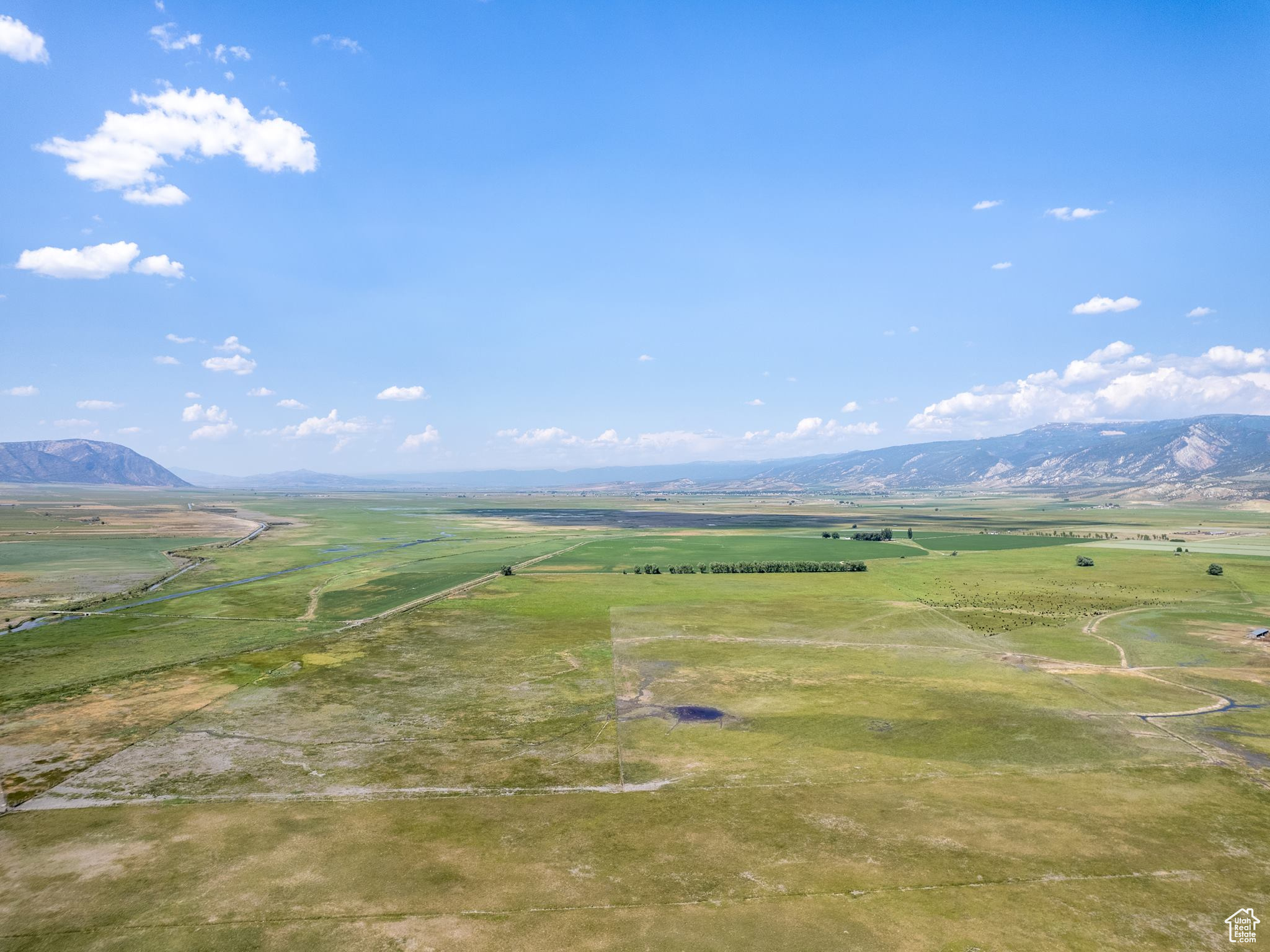 Birds eye view of property with a mountain view and a rural view