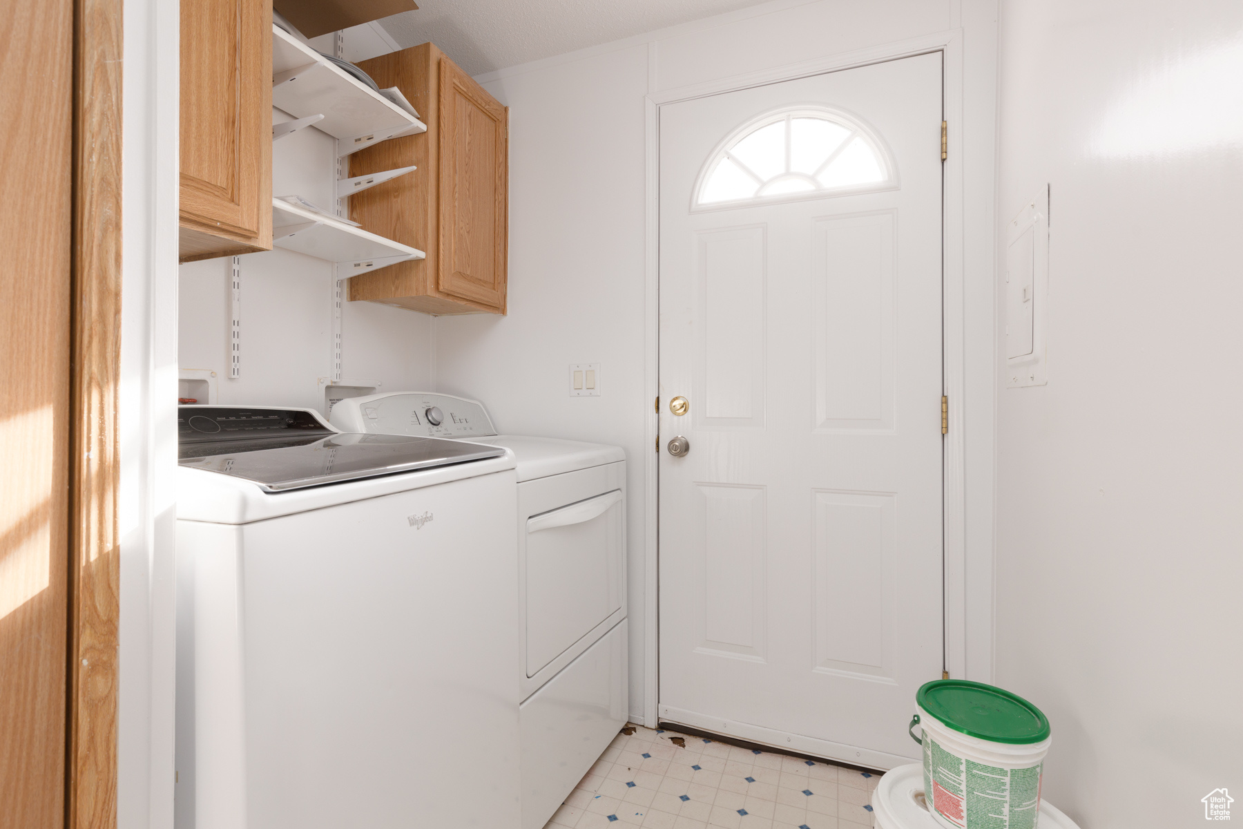 Laundry area featuring cabinets and independent washer and dryer