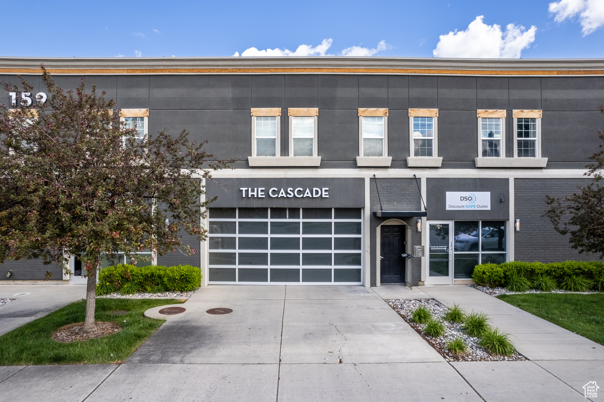 View of front facade featuring a garage