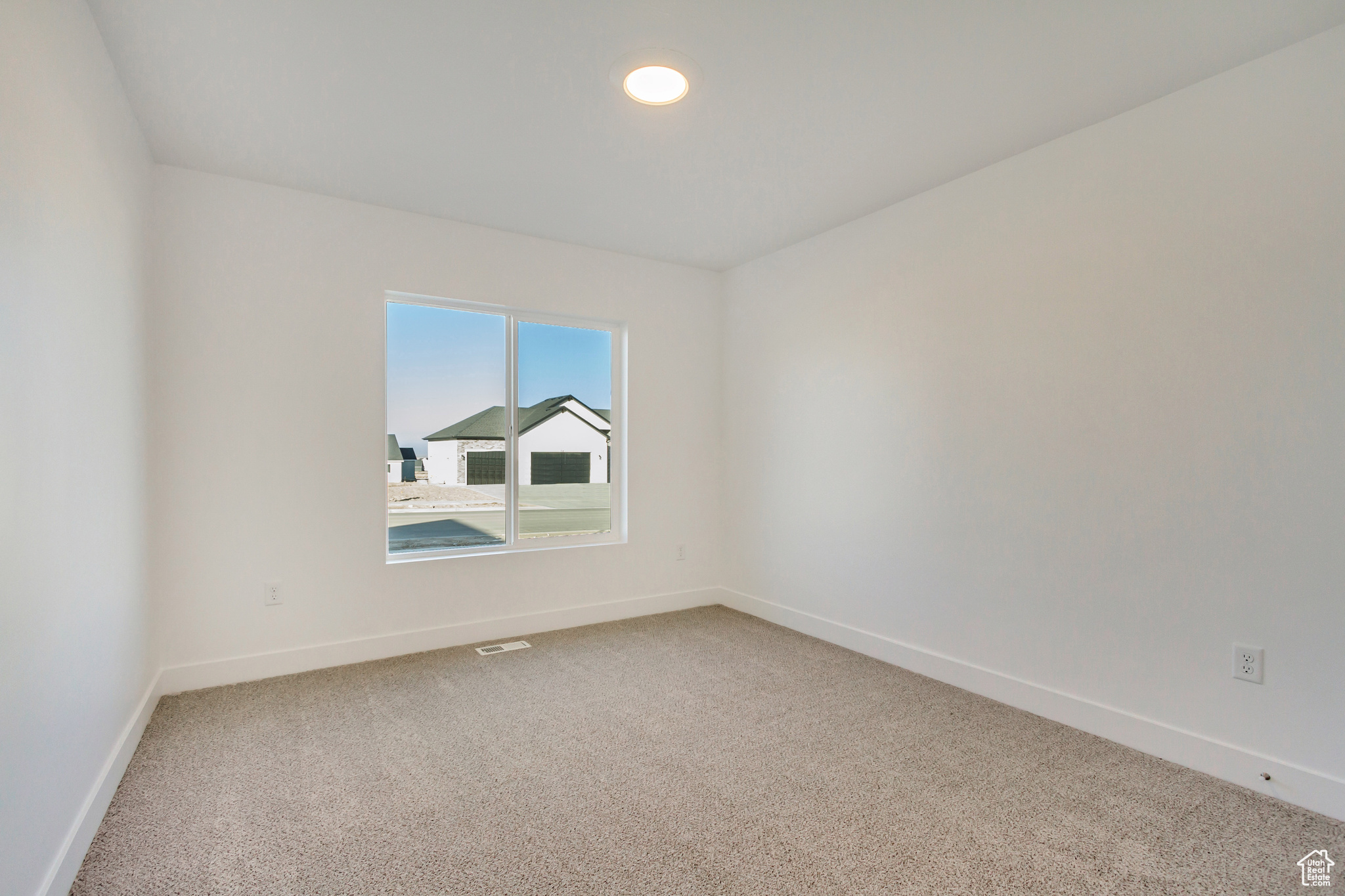 Unfurnished room featuring carpet