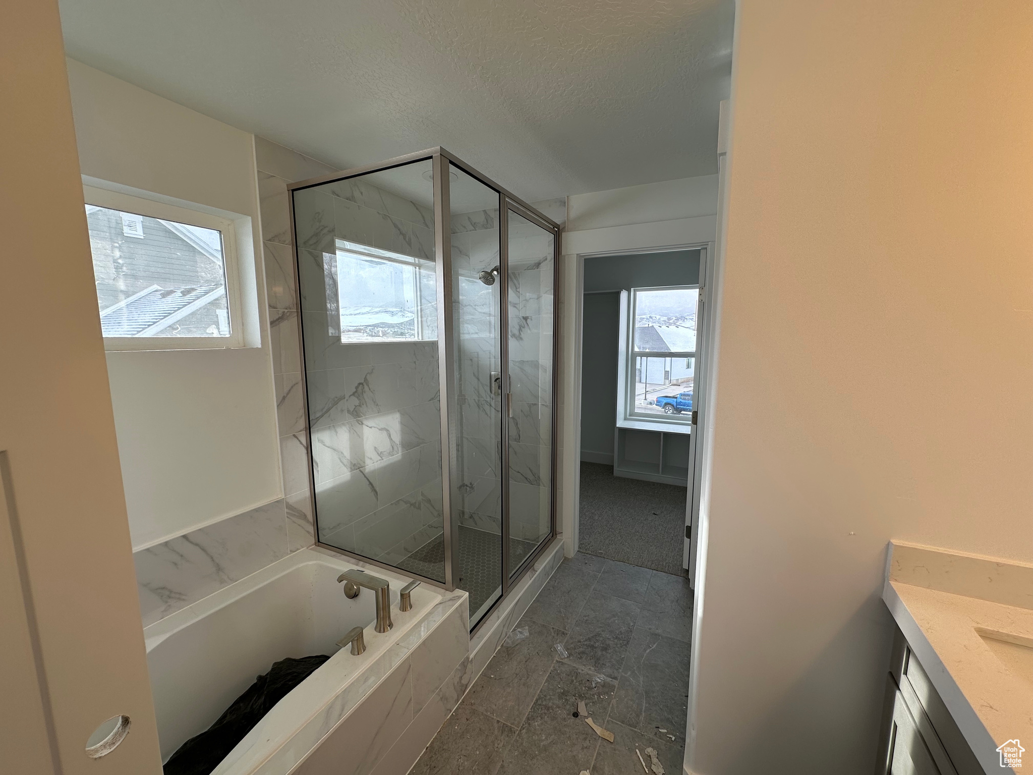 Owner's bathroom with separate soaker tub and shower.