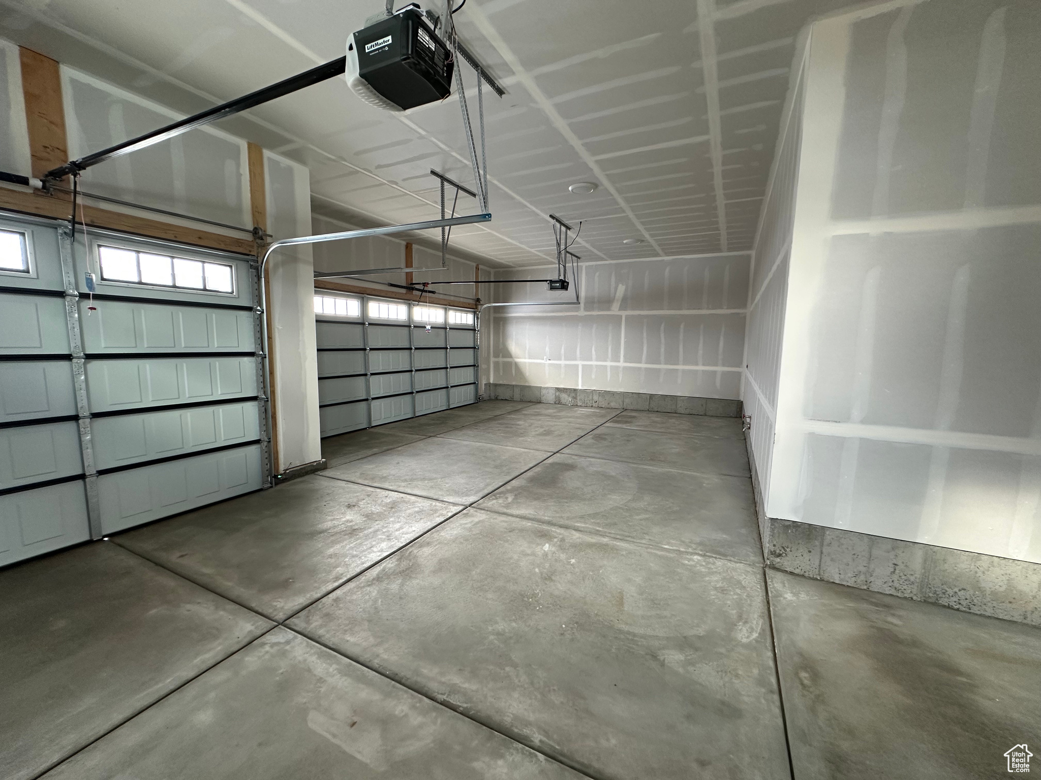 Large 3 bay garage with automatic openers and oversized 3rd bay.