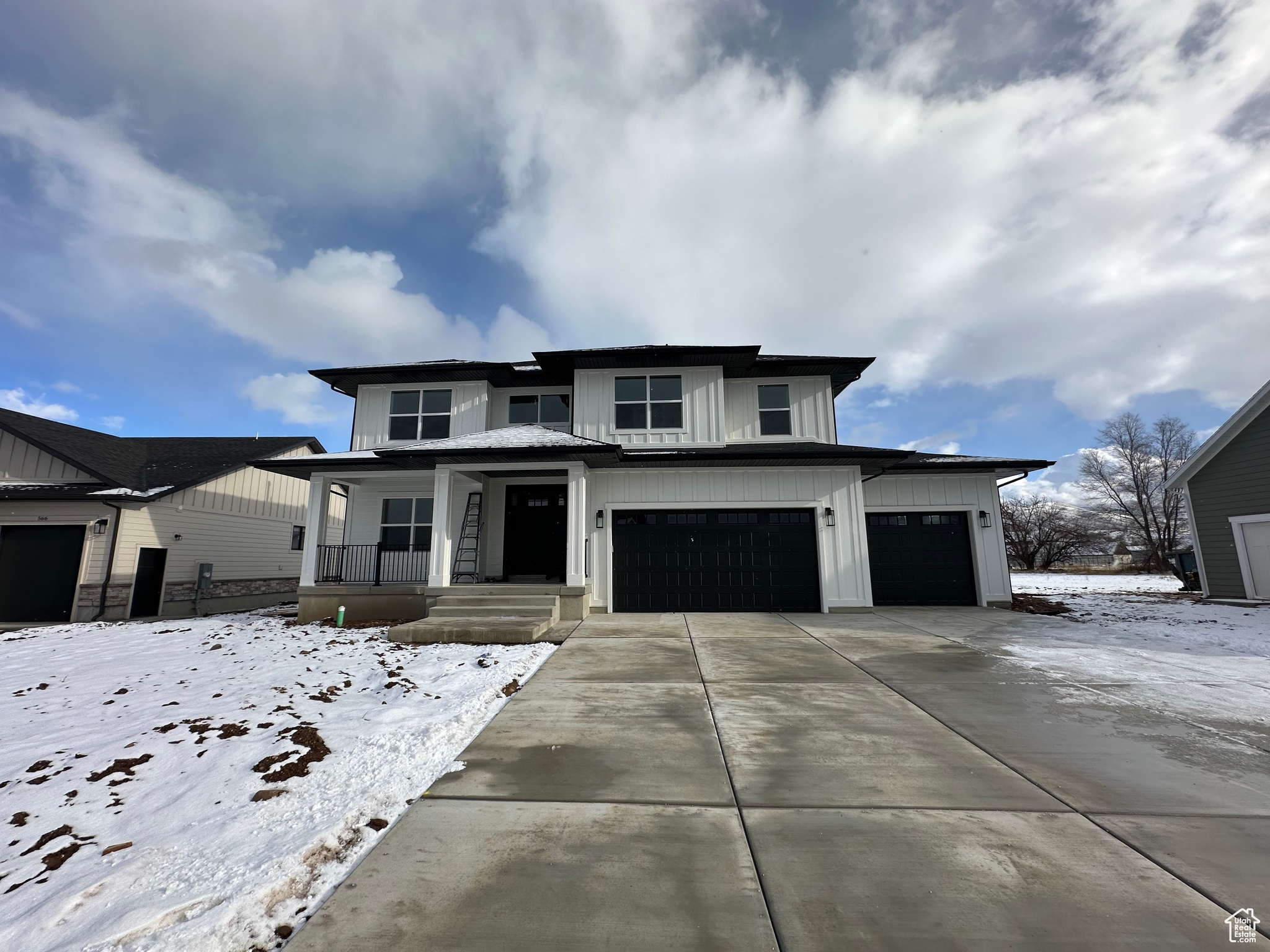 Large front porch, 3 car garage, 2-story home plan. Home faces west.