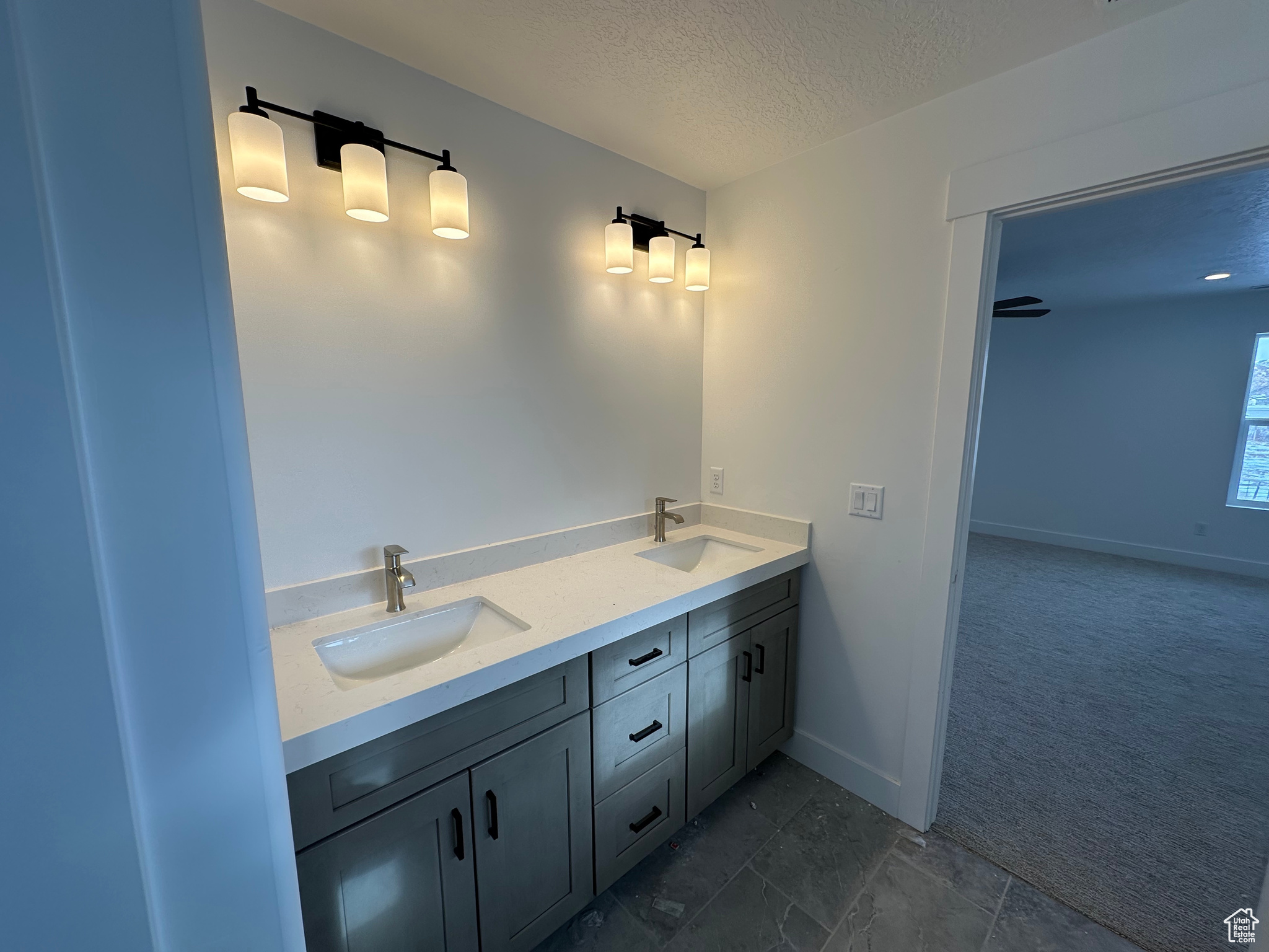 Owner's bathroom with double sink vanity.