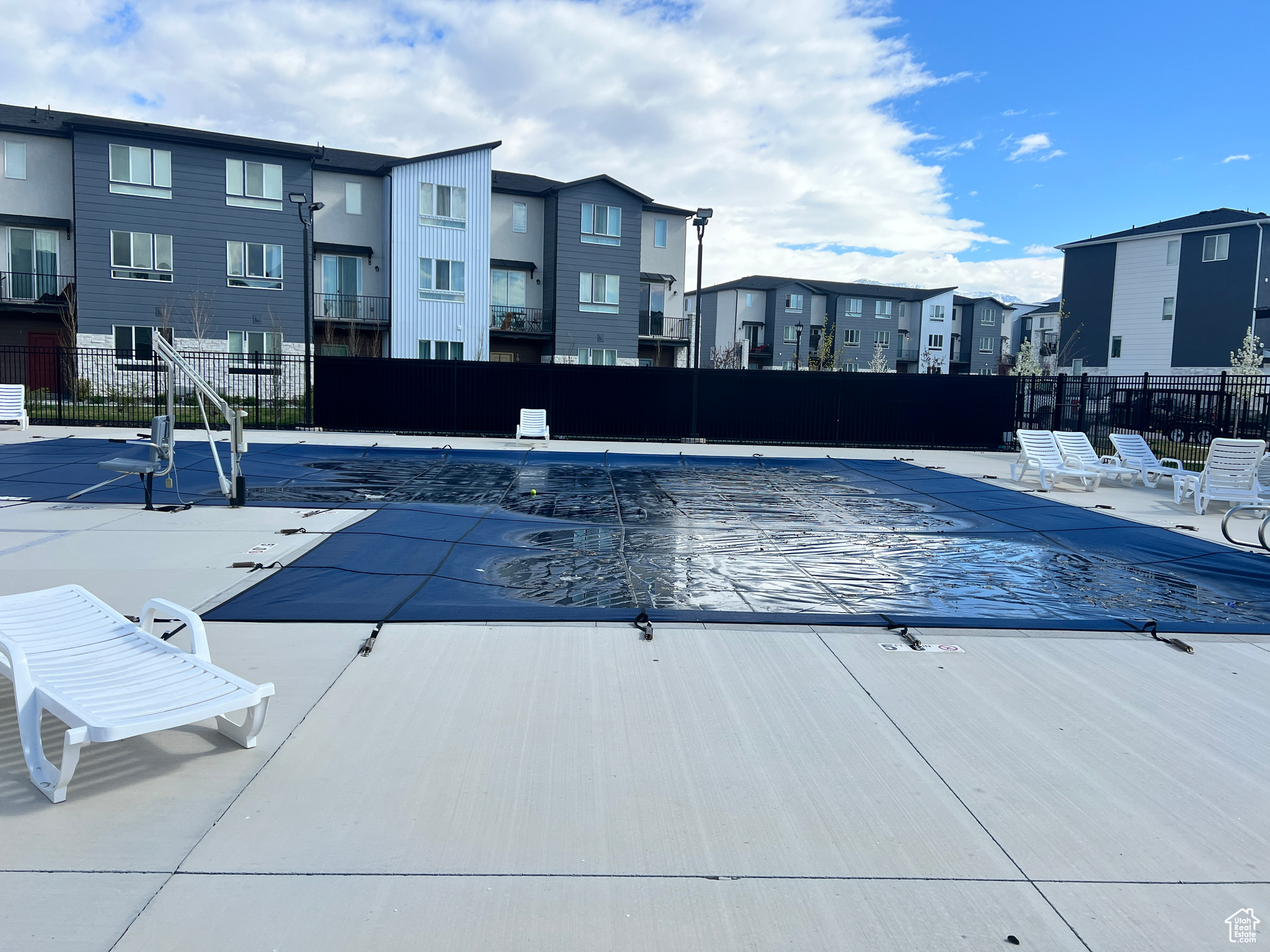 View of swimming pool with a patio area