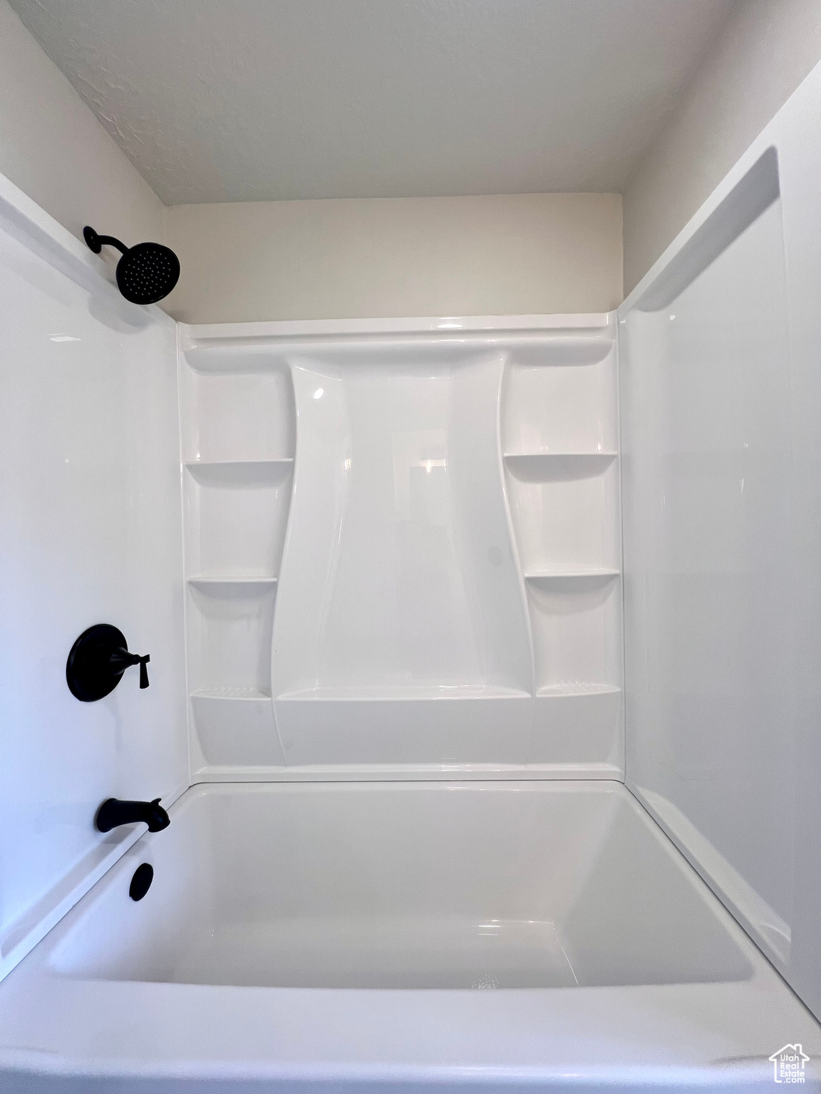 Bathroom featuring tub / shower combination