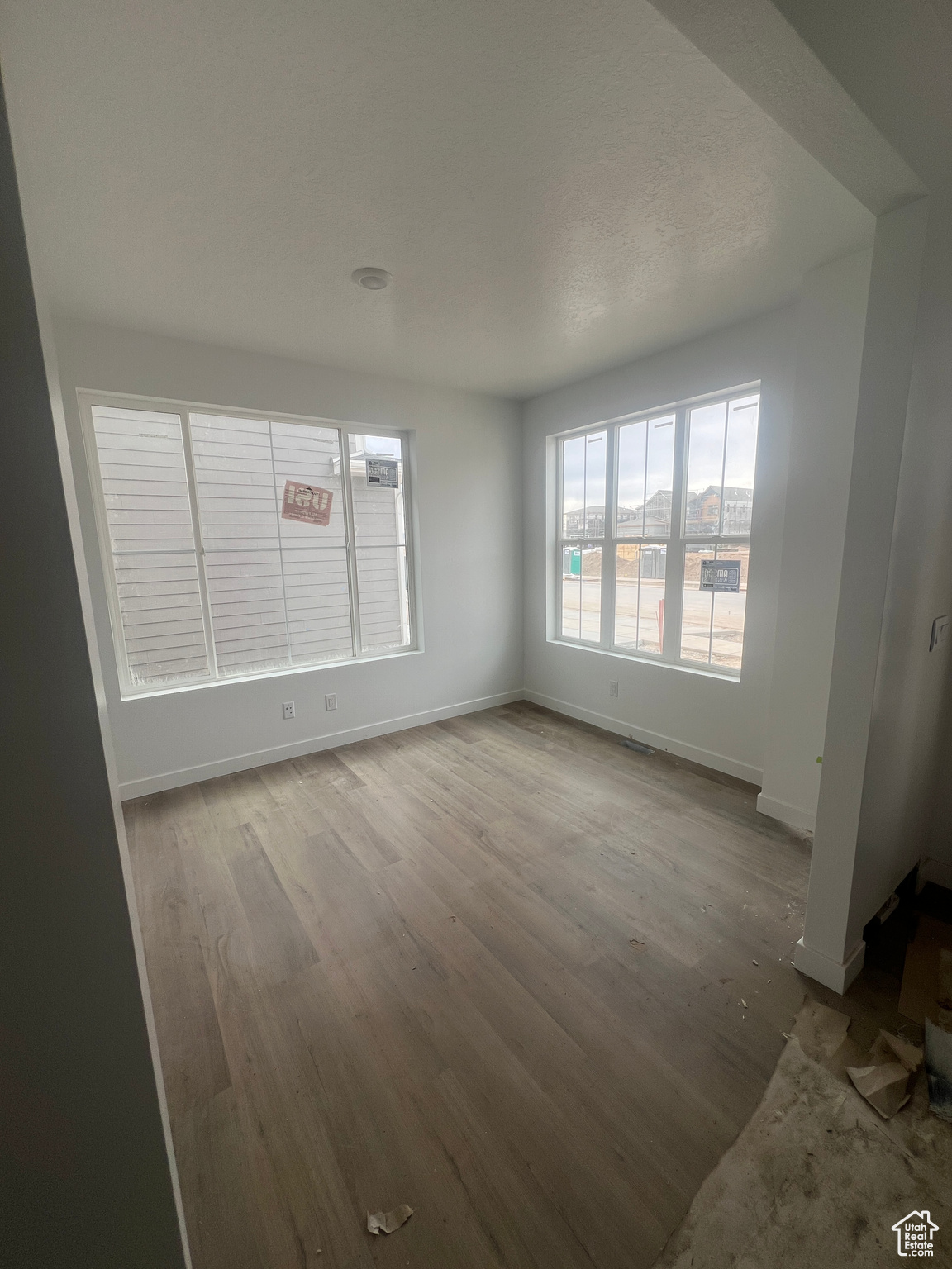 Unfurnished room with light wood-type flooring