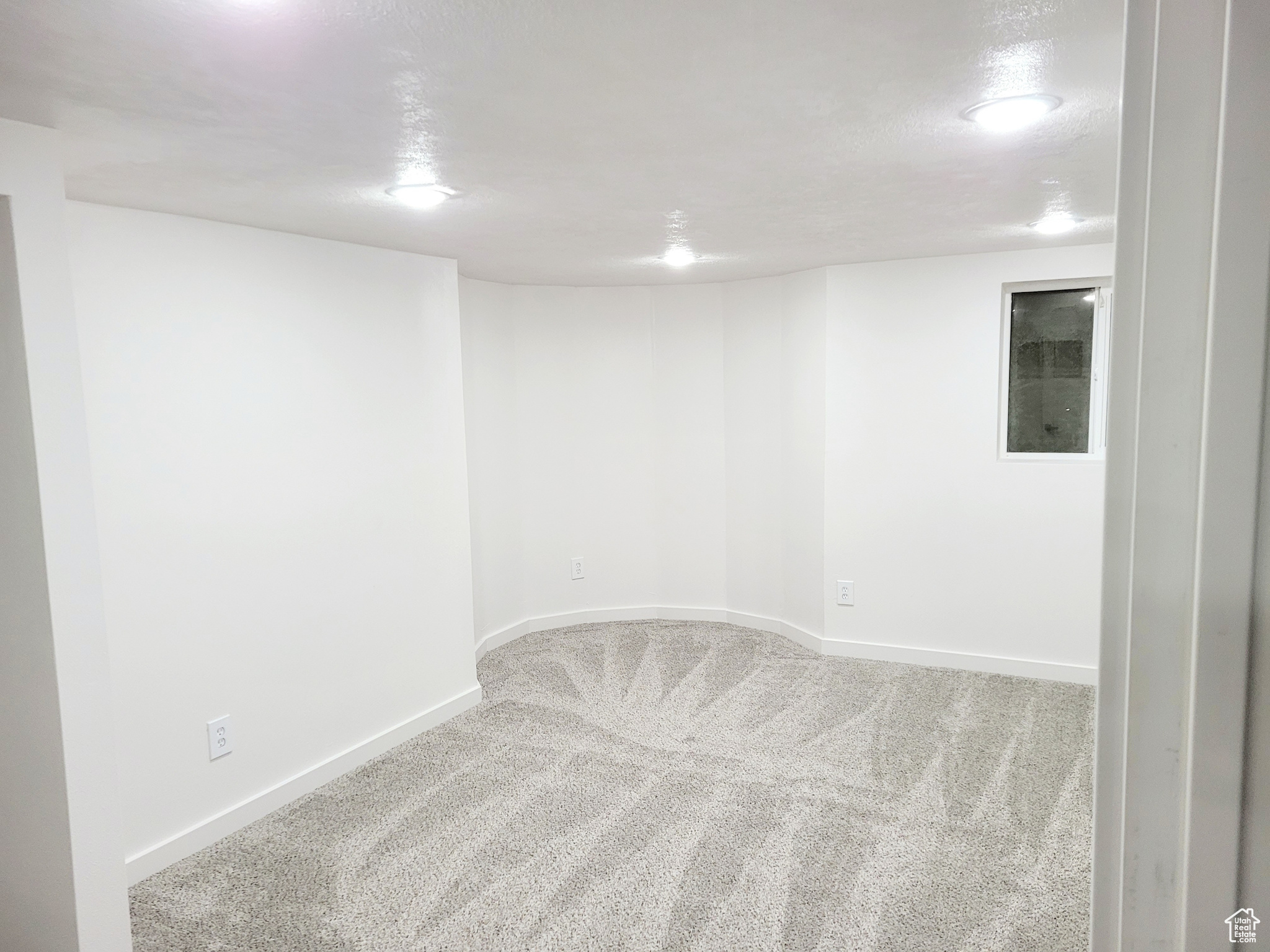 Spare room featuring carpet flooring