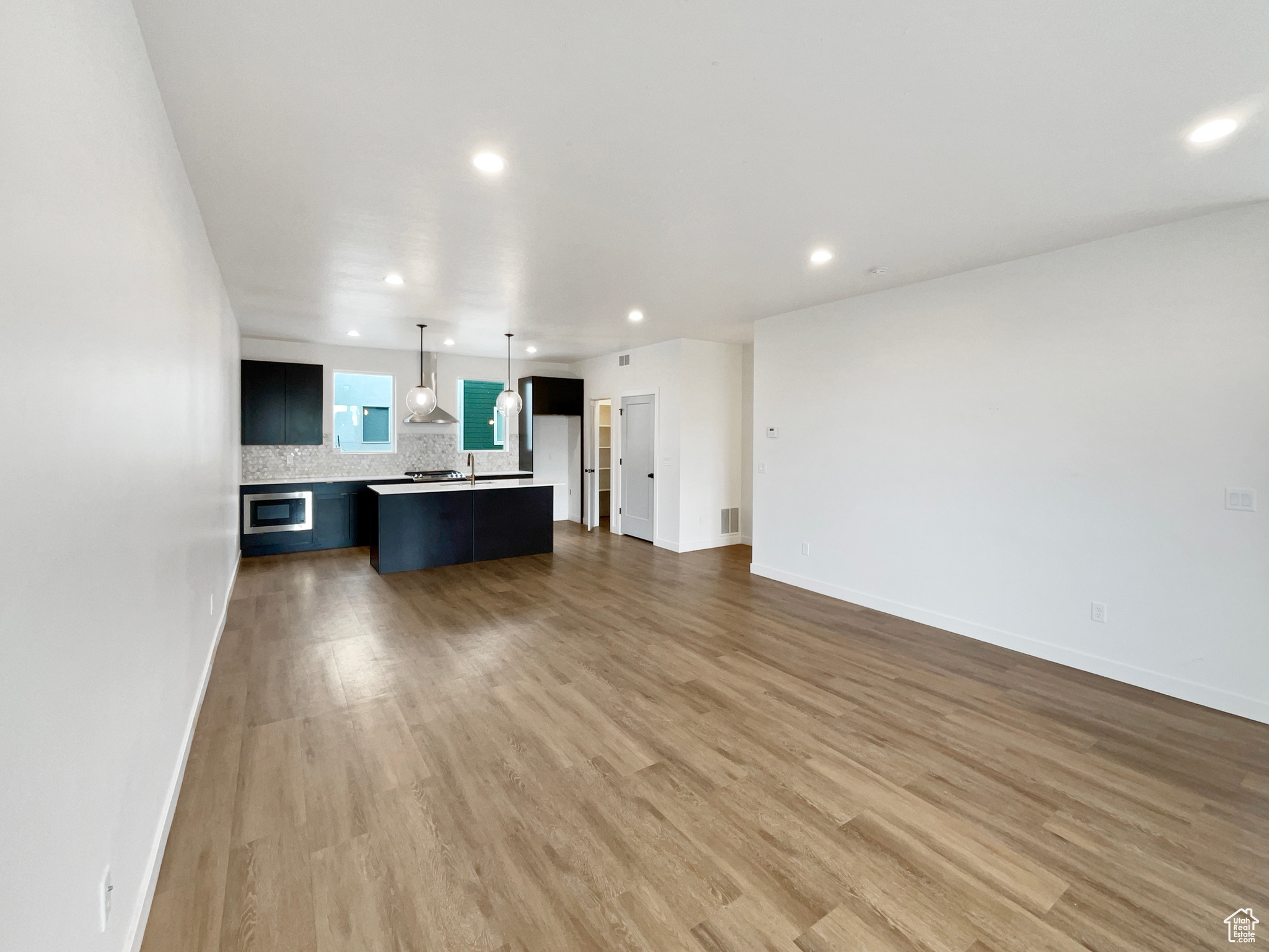 Unfurnished living room with wood-type flooring