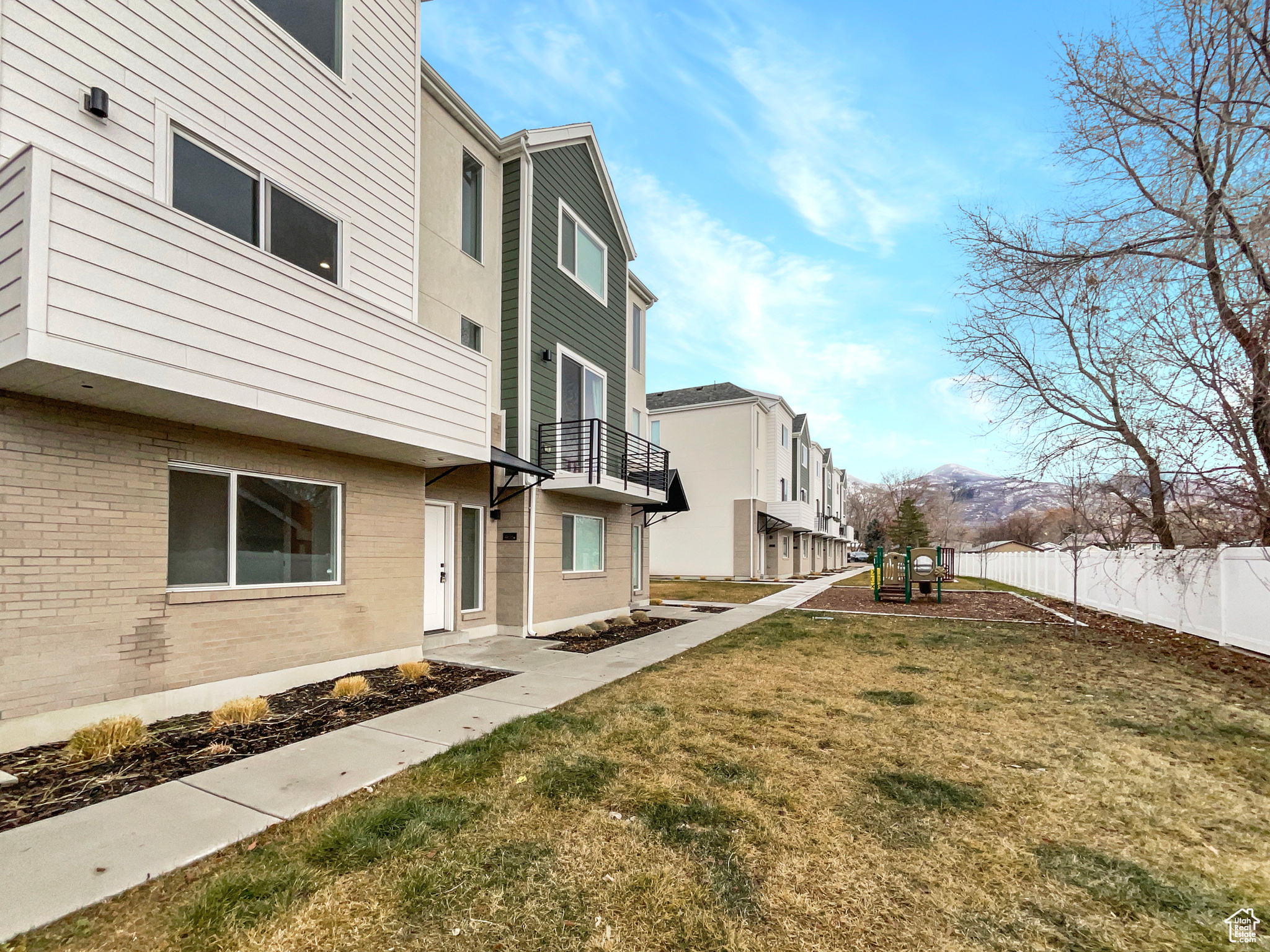 View of yard featuring a mountain view and a balcony