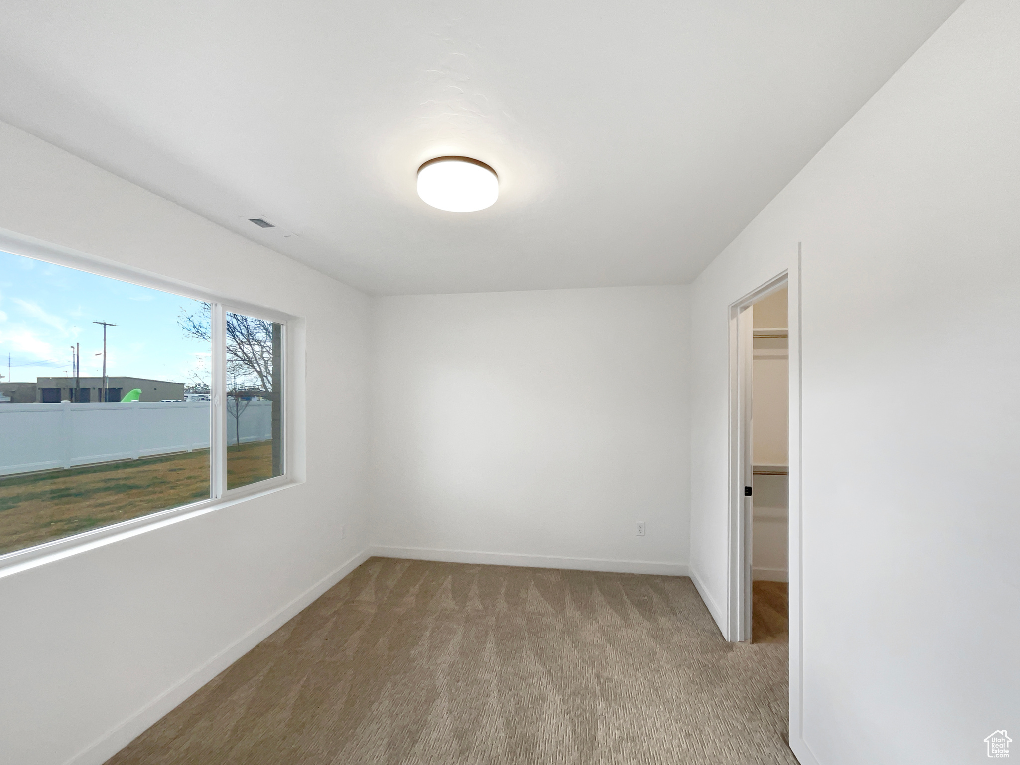 View of carpeted spare room