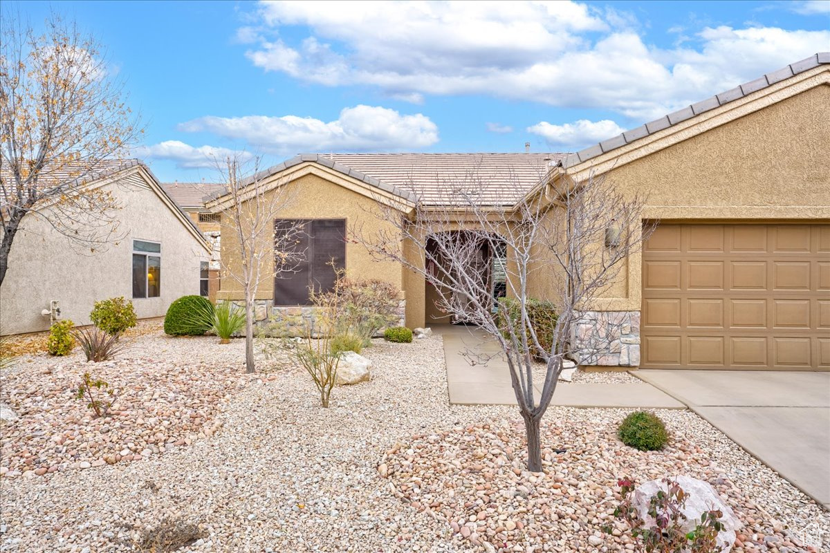 Ranch-style home featuring a garage