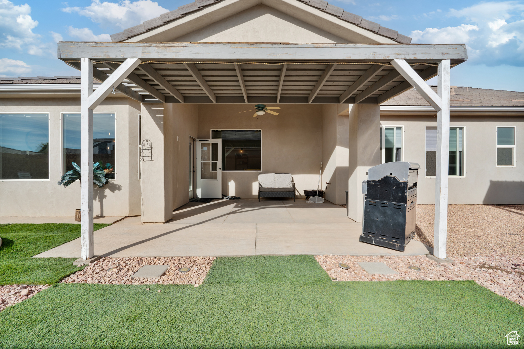 Exterior space with ceiling fan