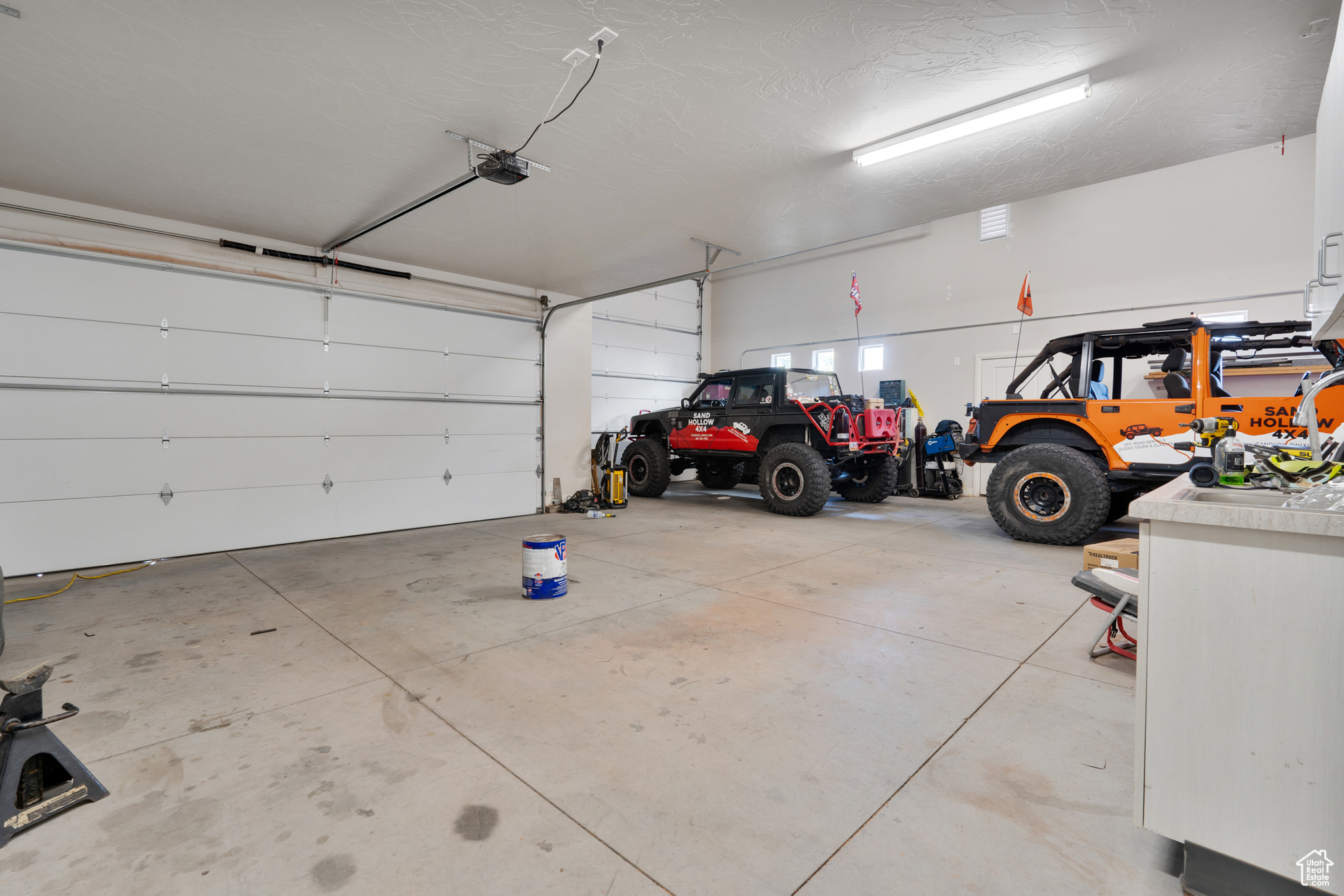 Garage featuring a garage door opener