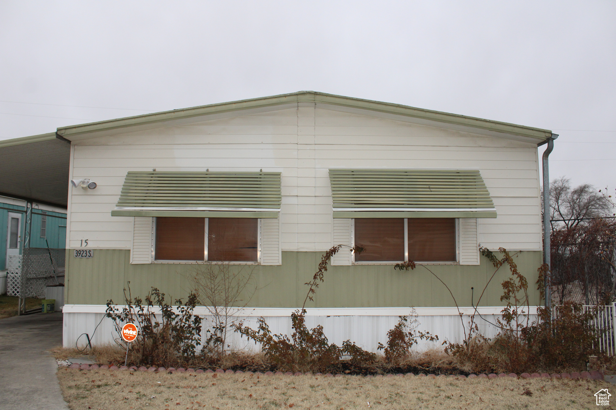 View of home's exterior with a carport