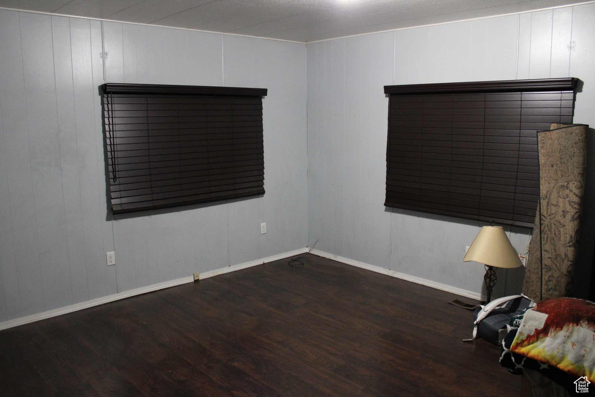 Unfurnished room with dark hardwood / wood-style floors