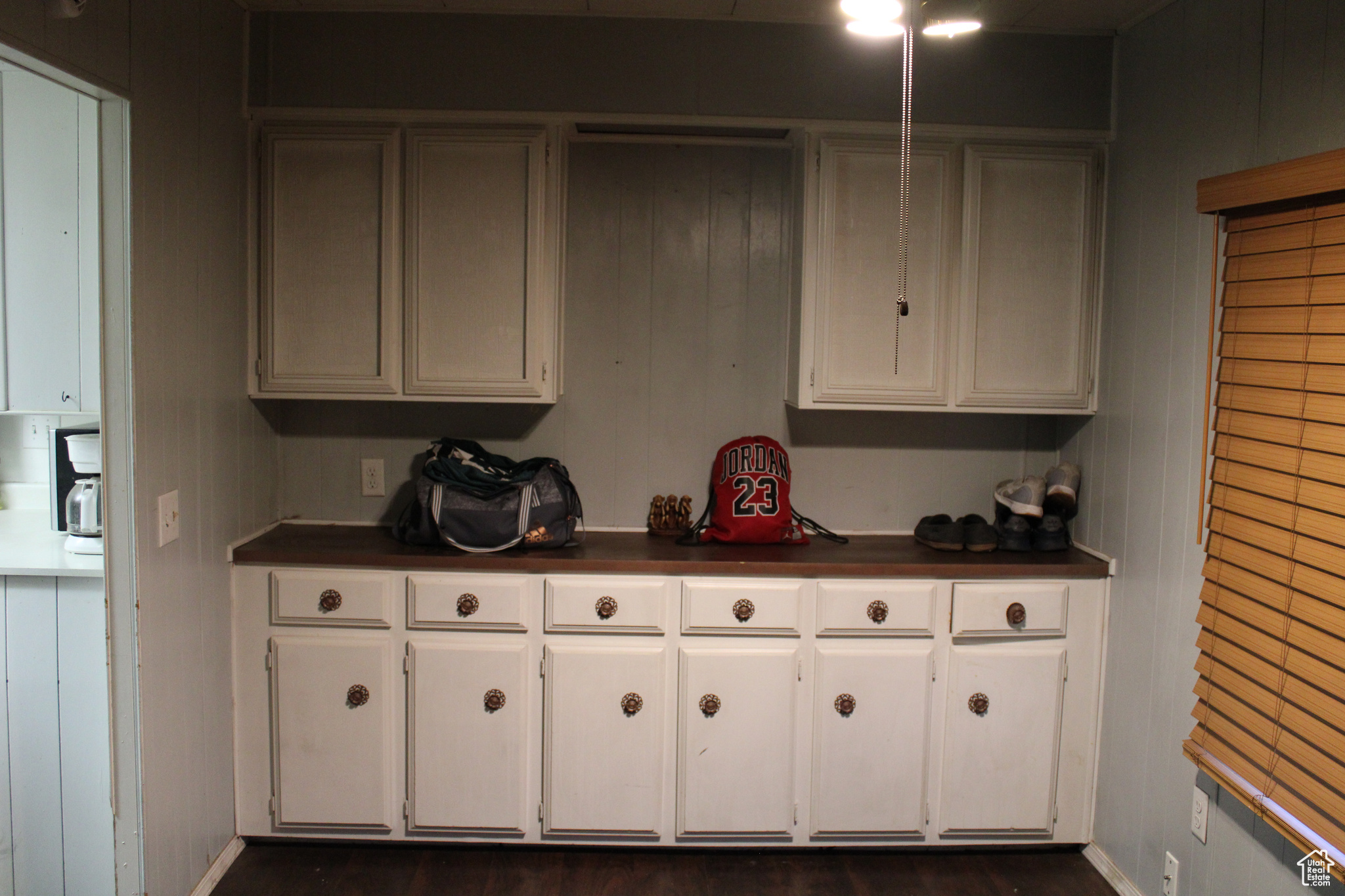 Kitchen featuring white cabinetry