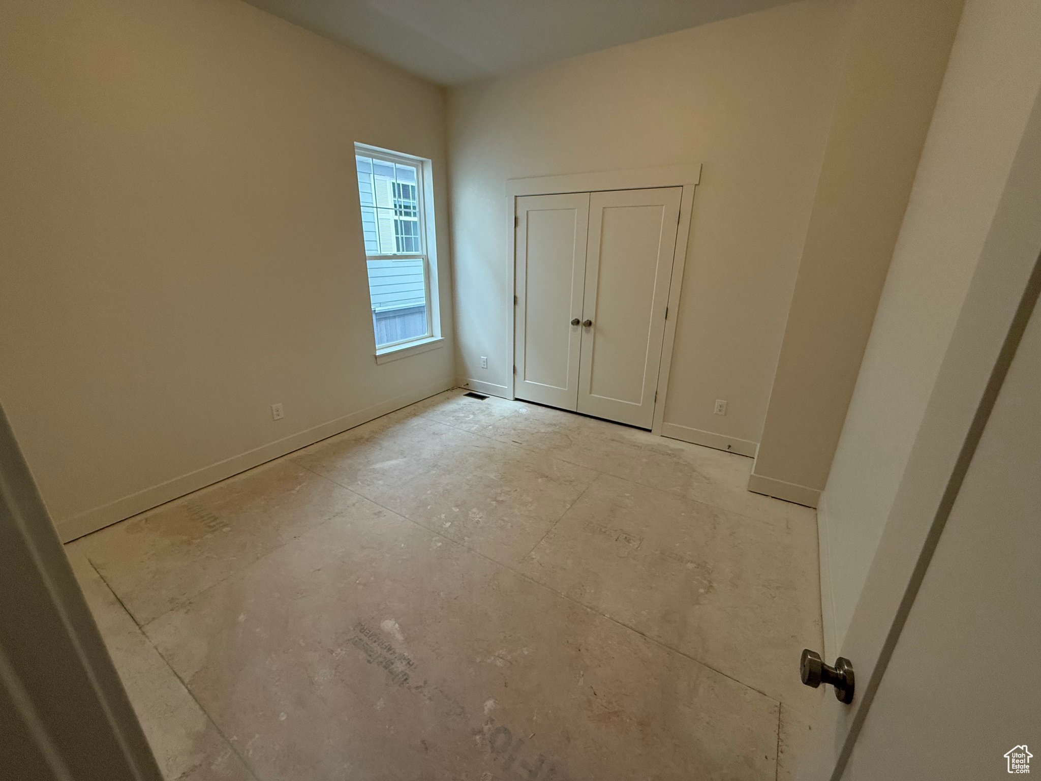 Secondary bedroom, soon to have carpet installed.