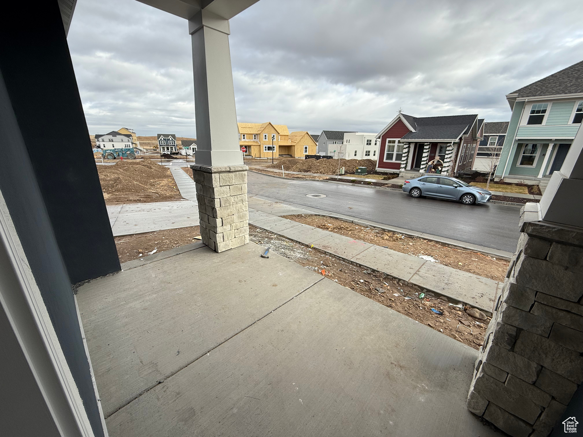 Patio off from kitchen, garage, and stairs to basement.