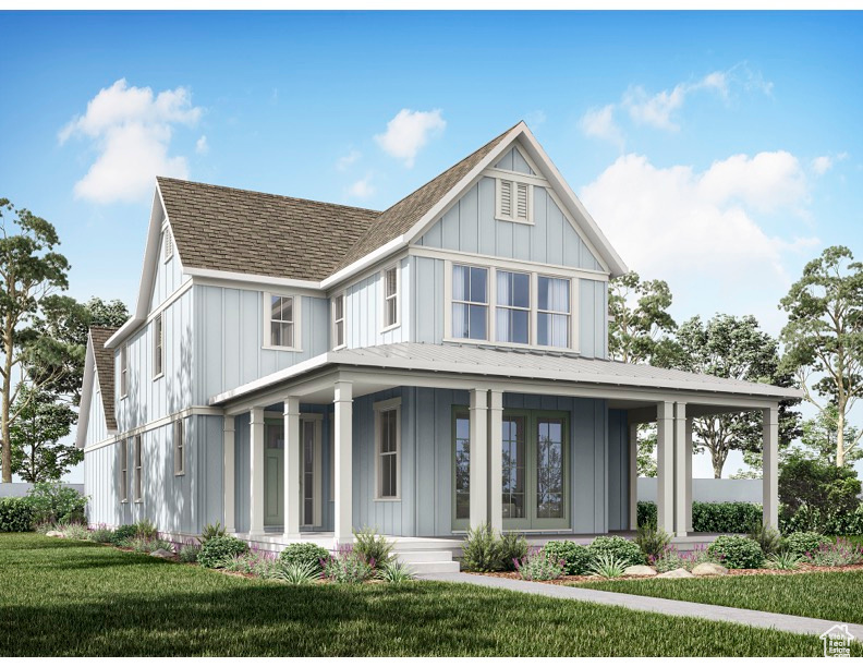 View of front of house featuring a front yard and covered porch