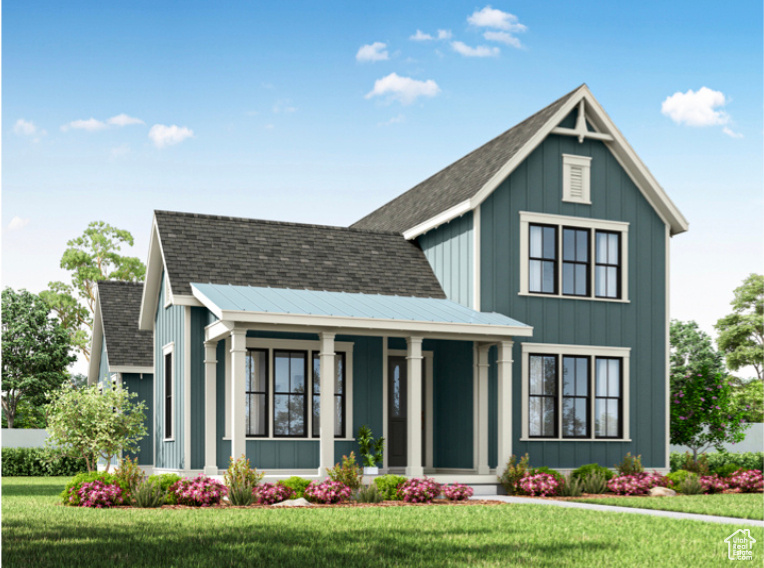 View of front facade with a front lawn and a porch