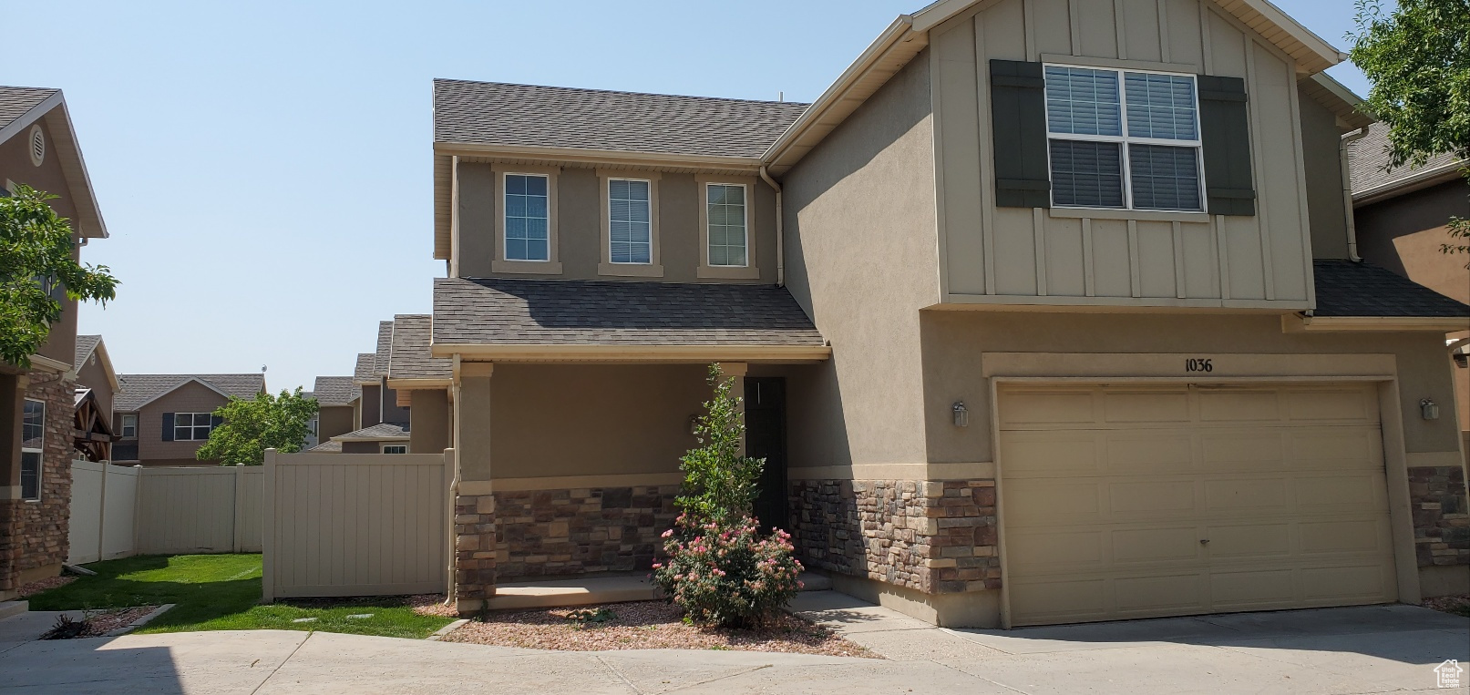 View of front of property featuring a garage