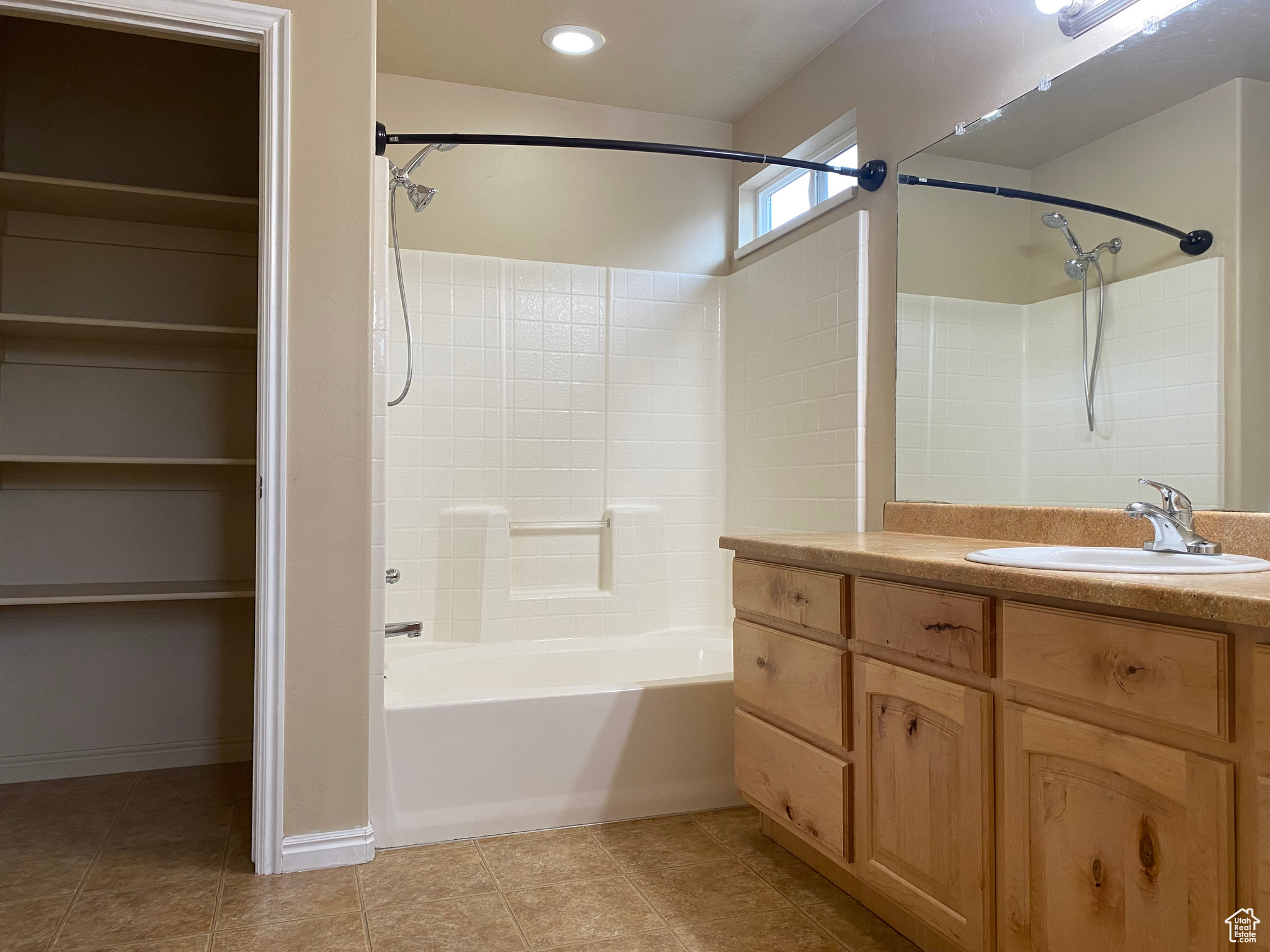 Bathroom featuring vanity and bathtub / shower combination