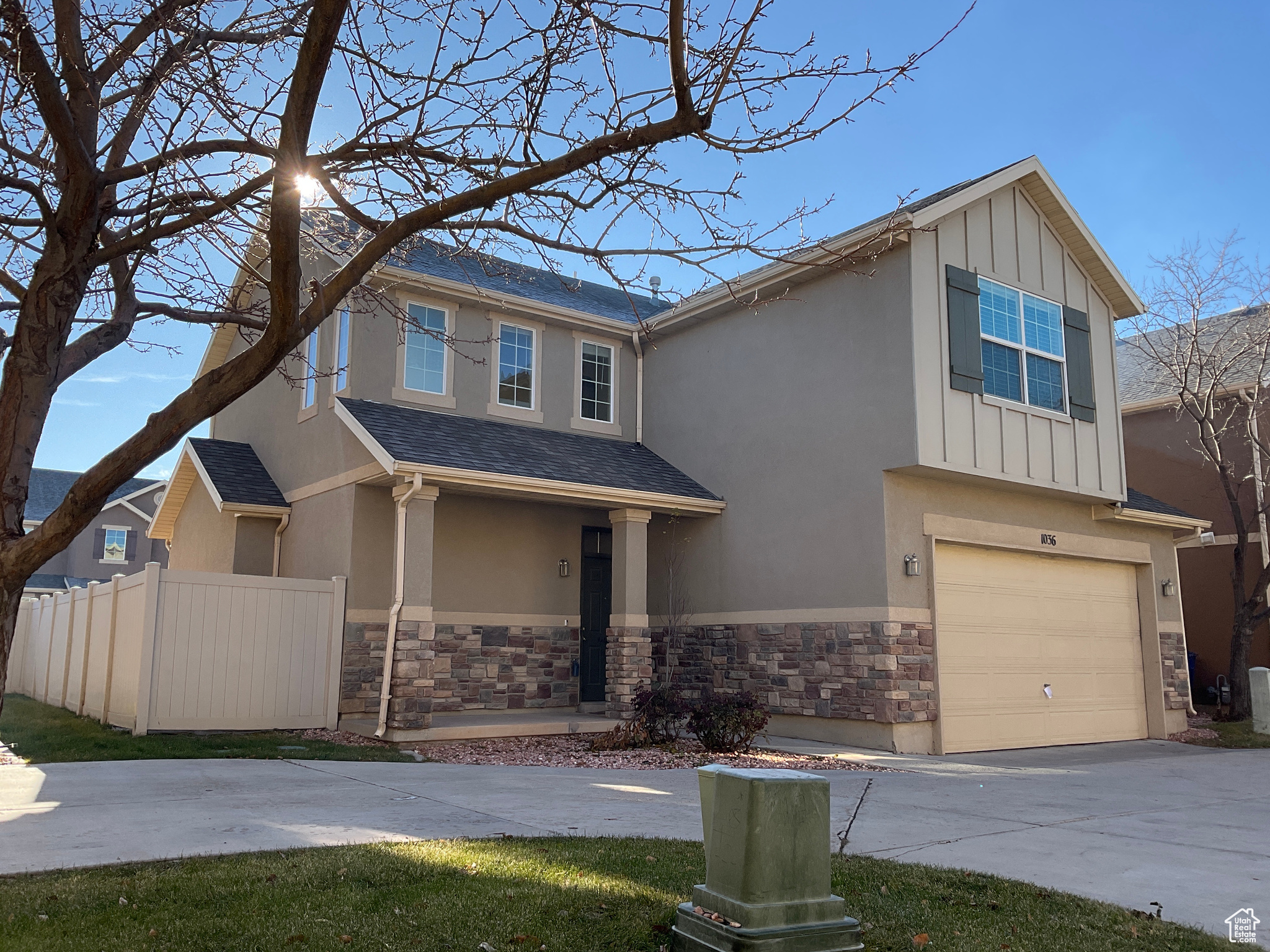 View of front facade featuring a garage