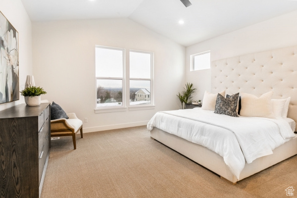 Carpeted bedroom with vaulted ceiling