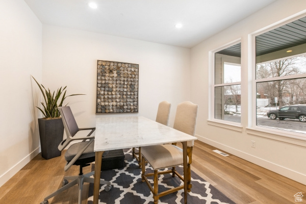 Office space featuring light hardwood / wood-style floors